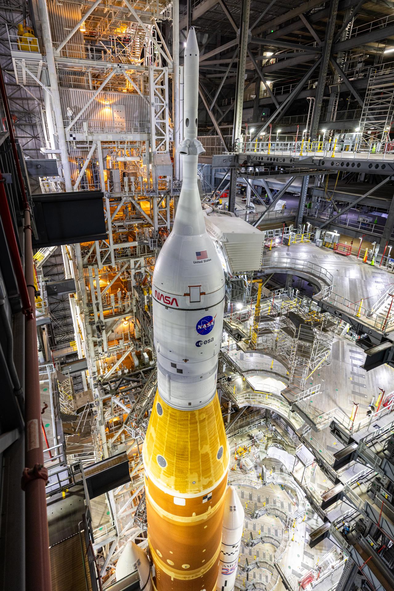 NASA’s Artemis II SLS (Space Launch System) rocket and Orion spacecraft, secured to the mobile launcher, prepares to roll out from the Vehicle Assembly Building to Launch Complex 39B at NASA’s Kennedy Space Center in Florida on Saturday, Jan. 17, 2026. The Artemis II test flight will take Commander Reid Wiseman, Pilot Victor Glover, and Mission Specialist Christina Koch from NASA, and Mission Specialist Jeremy Hansen from the CSA (Canadian Space Agency), around the Moon and back to Earth no later than April 2026.