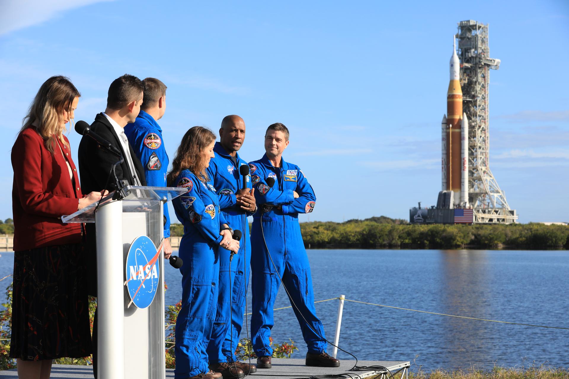 From left to right, NASA Press Secretary Bethany Stevens; NASA Administrator Jared Isaacman; NASA Associate Administrator Amit Kshatriya; Artemis II NASA astronauts Reid Wiseman, commander; Victor Glover, pilot, and Christina Koch, mission specialist, and CSA (Canadian Space Agency) Jeremy Hansen, mission specialist, speak to members of the media during NASA’s Artemis II SLS (Space Launch System) rocket and Orion spacecraft rollout to Launch Complex 39B at NASA’s Kennedy Space Center in Florida on Saturday, Jan. 17, 2026. In the coming weeks, engineers will prepare for the wet dress rehearsal, a two-day test that simulates launch day. The Artemis II test flight will take Commander Reid Wiseman, Pilot Victor Glover, and Mission Specialist Christina Koch from NASA, and Mission Specialist Jeremy Hansen from the CSA (Canadian Space Agency), around the Moon and back to Earth no later than April 2026.