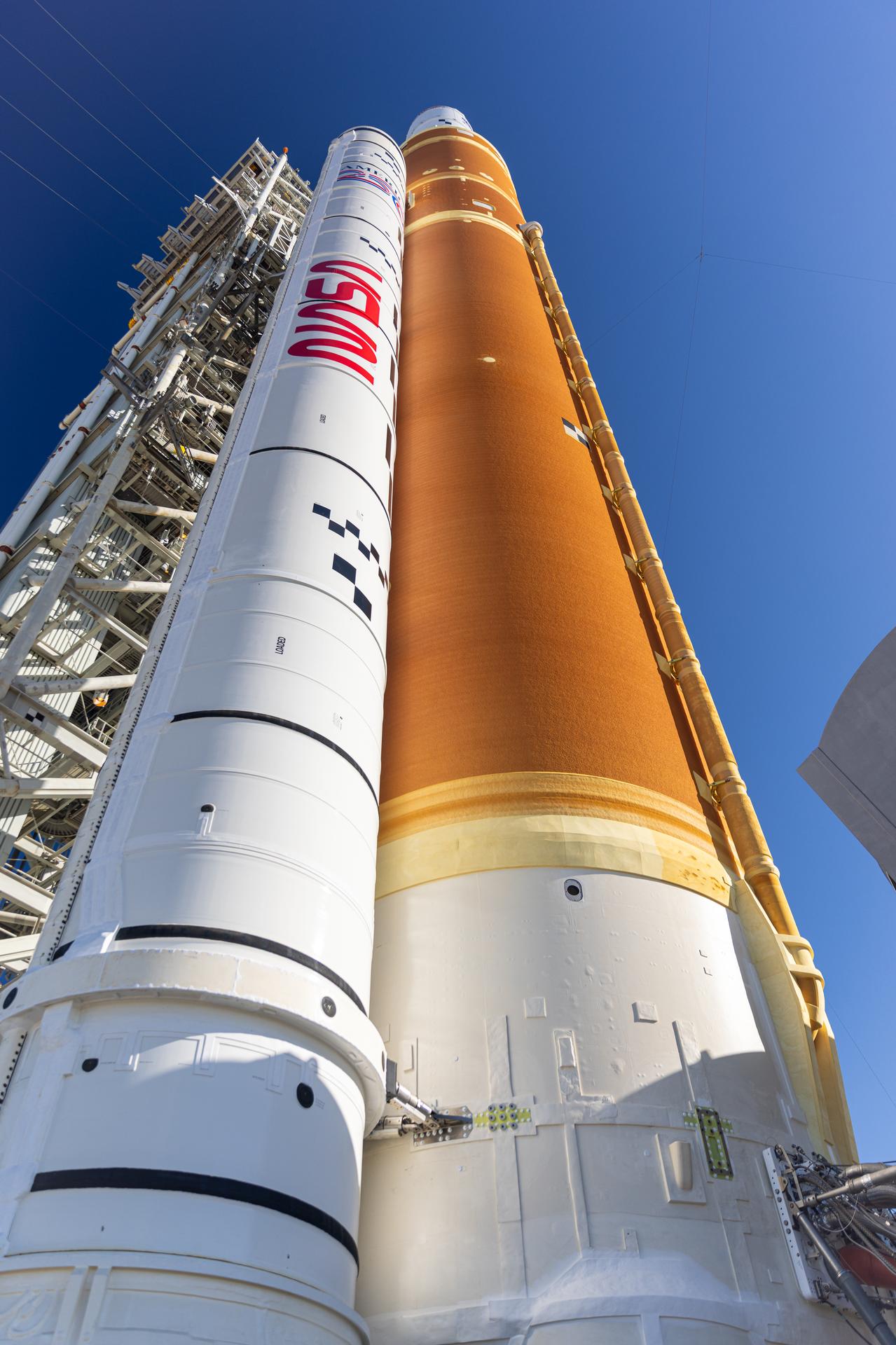 In this angle looking up, this photograph shows NASA’s Artemis II SLS (Space Launch System) rocket and Orion spacecraft, secured to the mobile launcher at Launch Complex 39B at NASA’s Kennedy Space Center in Florida on Tuesday, Jan. 20, 2026. The Artemis II test flight will take Commander Reid Wiseman, Pilot Victor Glover, and Mission Specialist Christina Koch from NASA, and Mission Specialist Jeremy Hansen from the CSA (Canadian Space Agency), on a 10-day journey no earlier than 6:24 p.m. EDT on Wednesday, April 1. 