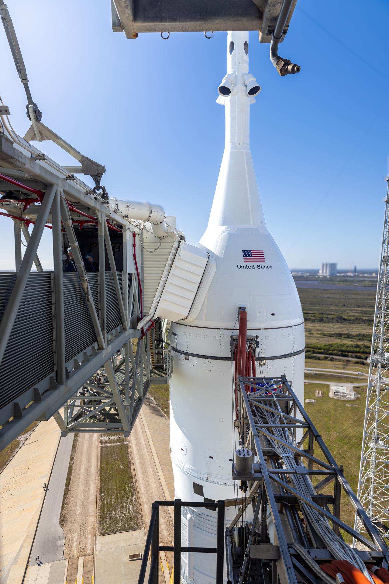 A closeup view of the crew access arm connected to NASA’s Orion spacecraft with the launch abort system atop NASA’s Artemis II SLS (Space Launch System) rocket at Launch Complex 39B at NASA’s Kennedy Space Center in Florida on Tuesday, Jan. 20, 2026. The Artemis II test flight will take Commander Reid Wiseman, Pilot Victor Glover, and Mission Specialist Christina Koch from NASA, and Mission Specialist Jeremy Hansen from the CSA (Canadian Space Agency), on a 10-day journey no earlier than 6:24 p.m. EDT on Wednesday, April 1. 