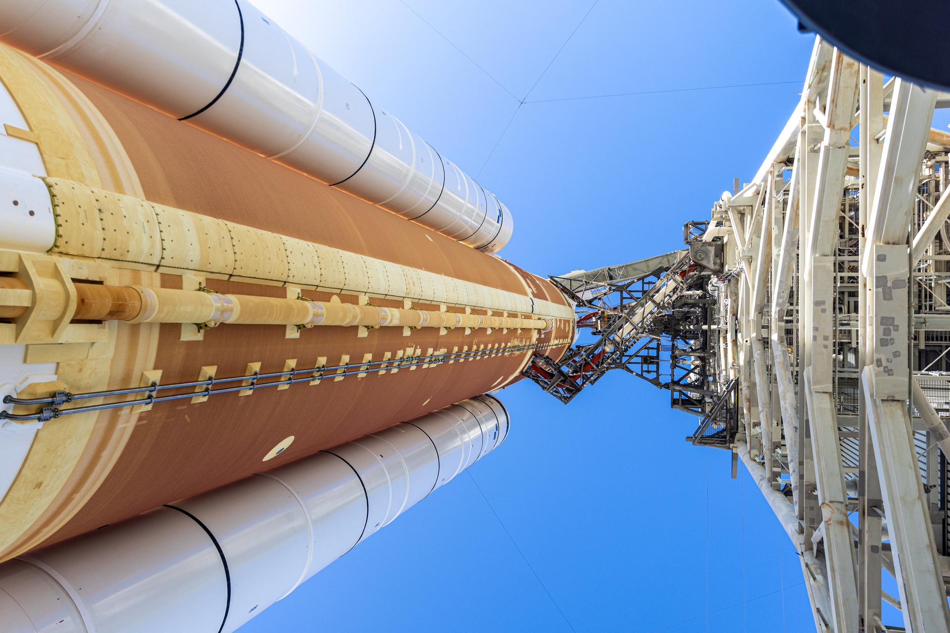 In this angle looking up, this photograph shows NASA’s Artemis II SLS (Space Launch System) rocket and Orion spacecraft, secured to the mobile launcher at Launch Complex 39B at NASA’s Kennedy Space Center in Florida on Tuesday, Jan. 20, 2026. The Artemis II test flight will take Commander Reid Wiseman, Pilot Victor Glover, and Mission Specialist Christina Koch from NASA, and Mission Specialist Jeremy Hansen from the CSA (Canadian Space Agency), on a 10-day journey no earlier than 6:24 p.m. EDT on Wednesday, April 1.