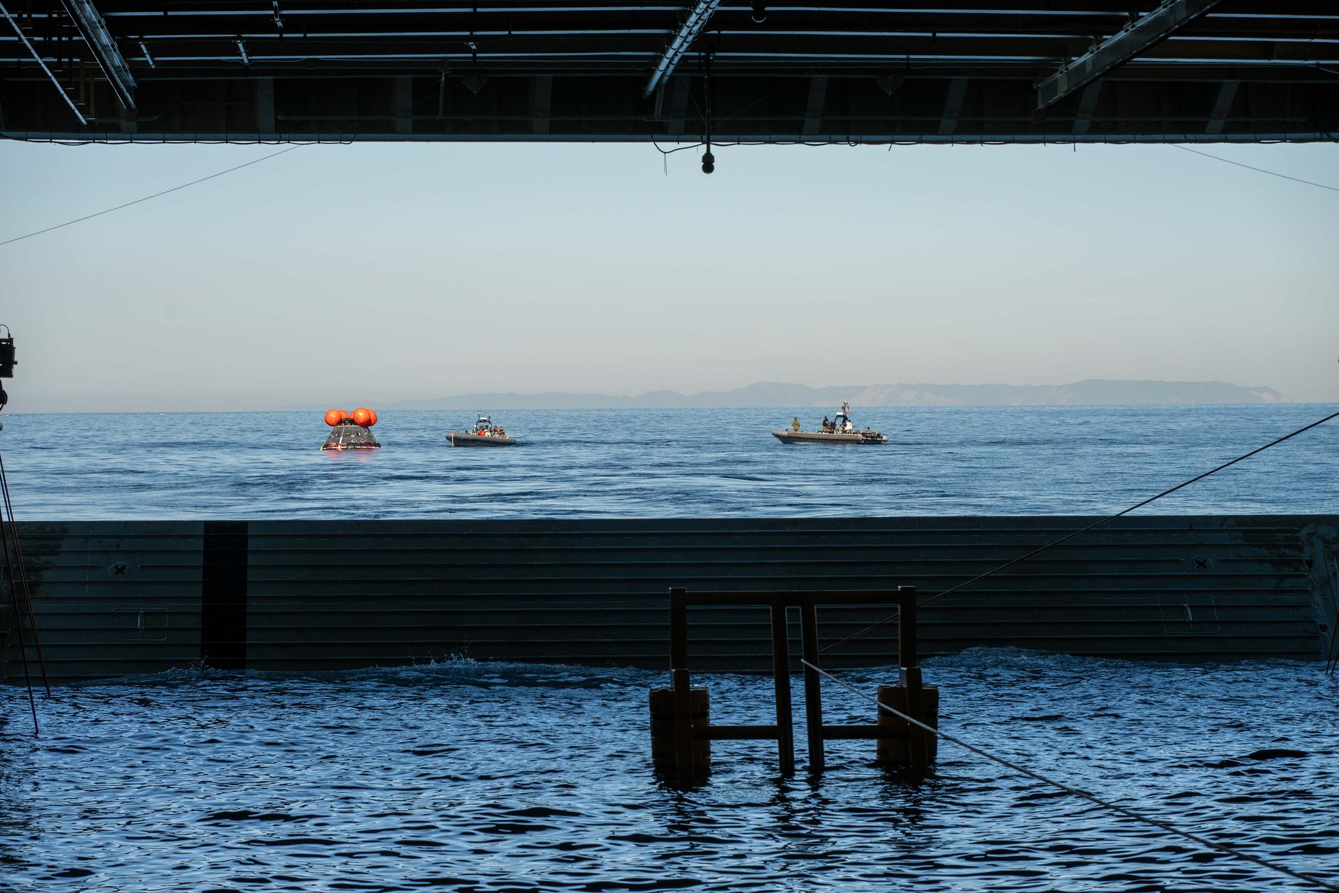Off the coast of California, NASA’s Artemis Landing and Recovery team and the Department of War that will work together to retrieve the Artemis II crew and Orion spacecraft following their return to Earth and splashdown in the Pacific Ocean are performing a final simulation of their activities, called a just-in-time training, at sea on Tuesday, Jan. 27, 2026. During the training, teams use the Crew Module Test Article, a full-scale mockup of the Orion spacecraft, to simulate as close as possible the conditions they can expect to encounter during splashdown of the Artemis II mission. NASA’s first crewed test flight in the Artemis campaign, the approximately 10-day Artemis II mission will send NASA astronauts Reid Wiseman, Victor Glover, and Christina Koch, and CSA (Canadian Space Agency) astronaut Jeremy Hansen around the Moon and farther than any humans have ever been from Earth.