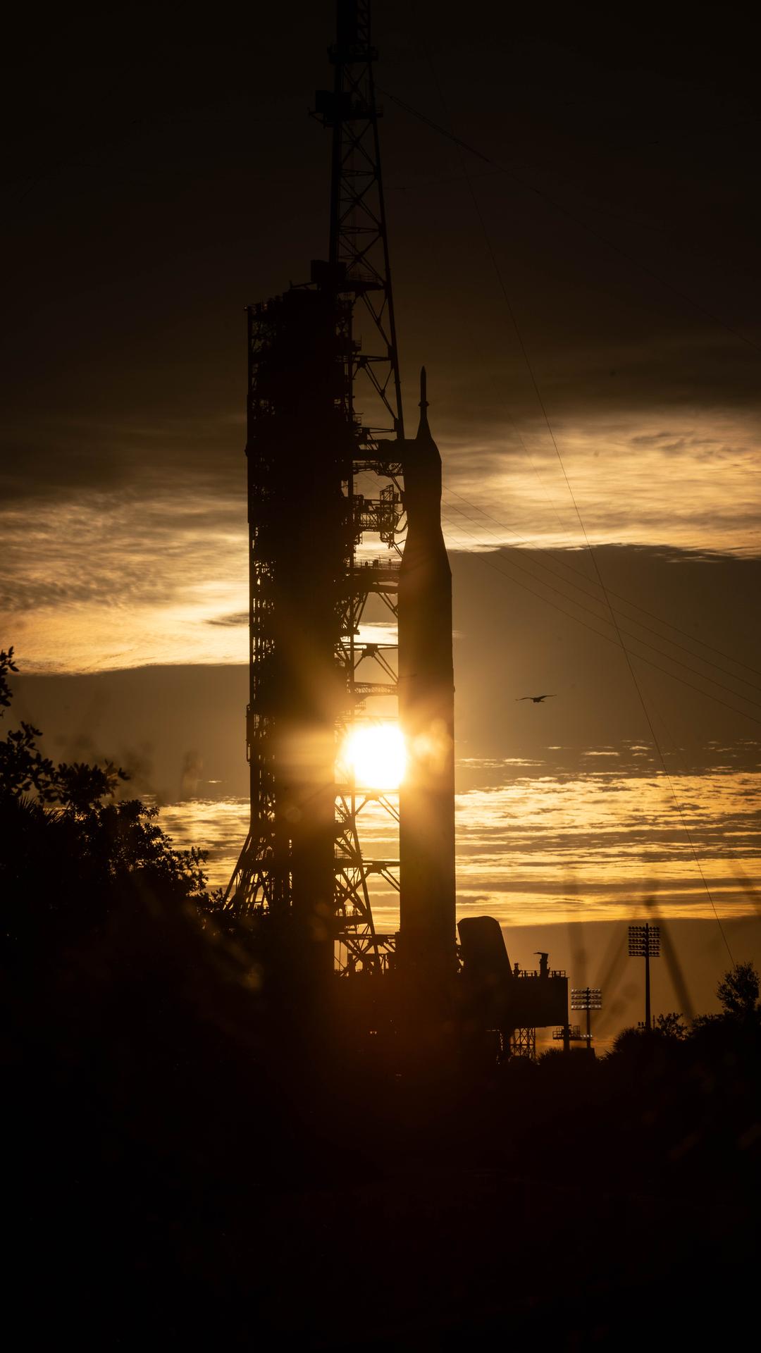 The Sun rises as NASA’s Artemis II SLS (Space Launch System) rocket and Orion spacecraft stand vertical at Launch Complex 39B at NASA’s Kennedy Space Center in Florida on Wednesday, Jan. 28, 2026. The Artemis II test flight will take Commander Reid Wiseman, Pilot Victor Glover, and Mission Specialist Christina Koch from NASA and Mission Specialist Jeremy Hansen from the CSA (Canadian Space Agency), around the Moon and back to Earth no later than April 2026.