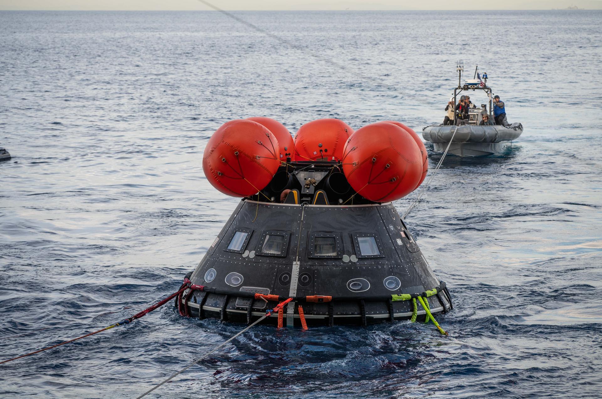 Off the coast of California, NASA’s Artemis Landing and Recovery team and the Department of War that will work together to retrieve the Artemis II crew and Orion spacecraft following their return to Earth and splashdown in the Pacific Ocean are performing a final simulation of their activities, called a just-in-time training, at sea on Wednesday, Jan. 28, 2026. During the training, teams use the Crew Module Test Article, a full-scale mockup of the Orion spacecraft, to simulate as close as possible the conditions they can expect to encounter during splashdown of the Artemis II mission. NASA’s first crewed test flight in the Artemis campaign, the approximately 10-day Artemis II mission will send NASA astronauts Reid Wiseman, Victor Glover, and Christina Koch, and CSA (Canadian Space Agency) astronaut Jeremy Hansen around the Moon and farther than any humans have ever been from Earth.