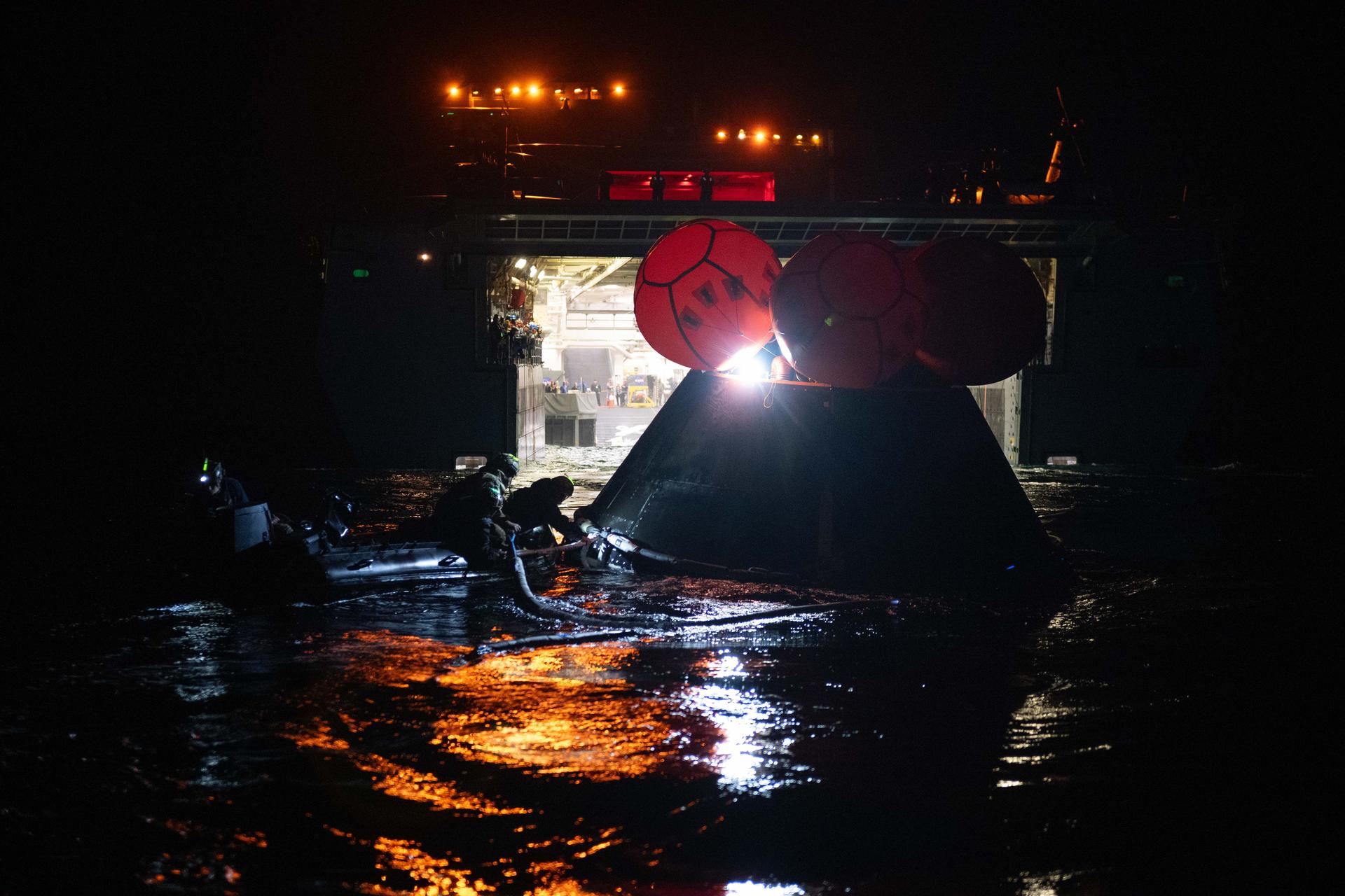 Members from NASA’s Artemis Landing and Recovery team and the Department of War perform a final simulation of the Artemis II splashdown, called a just-in-time training, in the Pacific Ocean off the coast of California on Thursday, Jan. 29, 2026. The teams will work together to retrieve the Artemis II crew and Orion spacecraft following their return to Earth, and during the training the teams use the Crew Module Test Article, a full-scale mockup of the Orion spacecraft, to simulate as close as possible the conditions they can expect to encounter during splashdown of the Artemis II mission. NASA’s first crewed test flight in the Artemis campaign, the approximately 10-day Artemis II mission will send NASA astronauts Reid Wiseman, Victor Glover, and Christina Koch, and CSA (Canadian Space Agency) astronaut Jeremy Hansen around the Moon and farther than any humans have ever been from Earth.