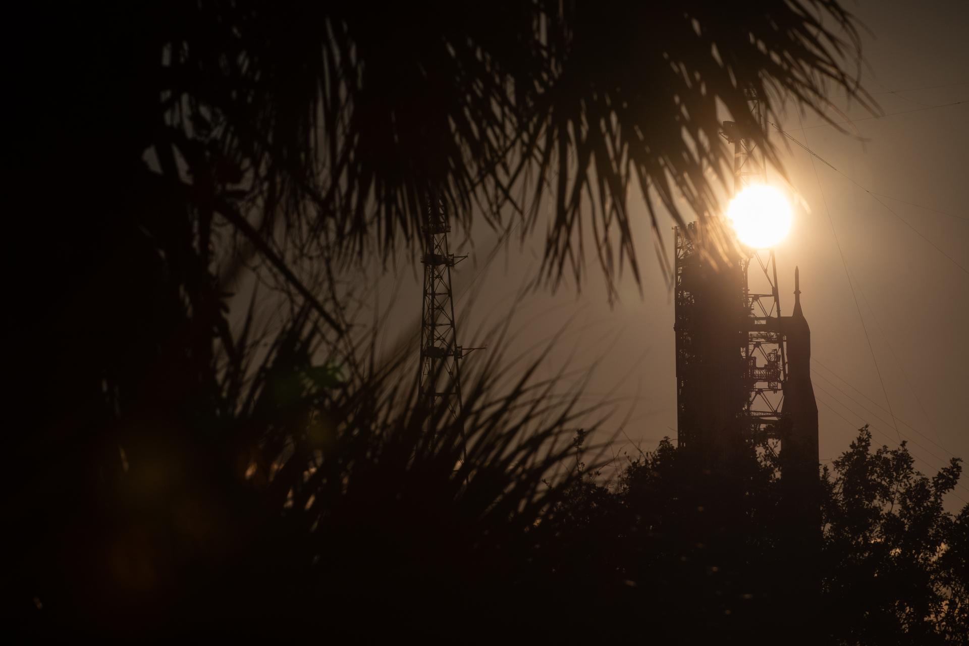 The Sun shines behind NASA’s Artemis II SLS (Space Launch System) rocket and Orion spacecraft atop a mobile launcher at Launch Complex 39B at NASA’s Kennedy Space Center in Florida on Sunday, Feb. 1, 2026. The Artemis II test flight will take Commander Reid Wiseman, Pilot Victor Glover, and Mission Specialist Christina Koch from NASA, and Mission Specialist Jeremy Hansen from the CSA (Canadian Space Agency), around the Moon and back to Earth.