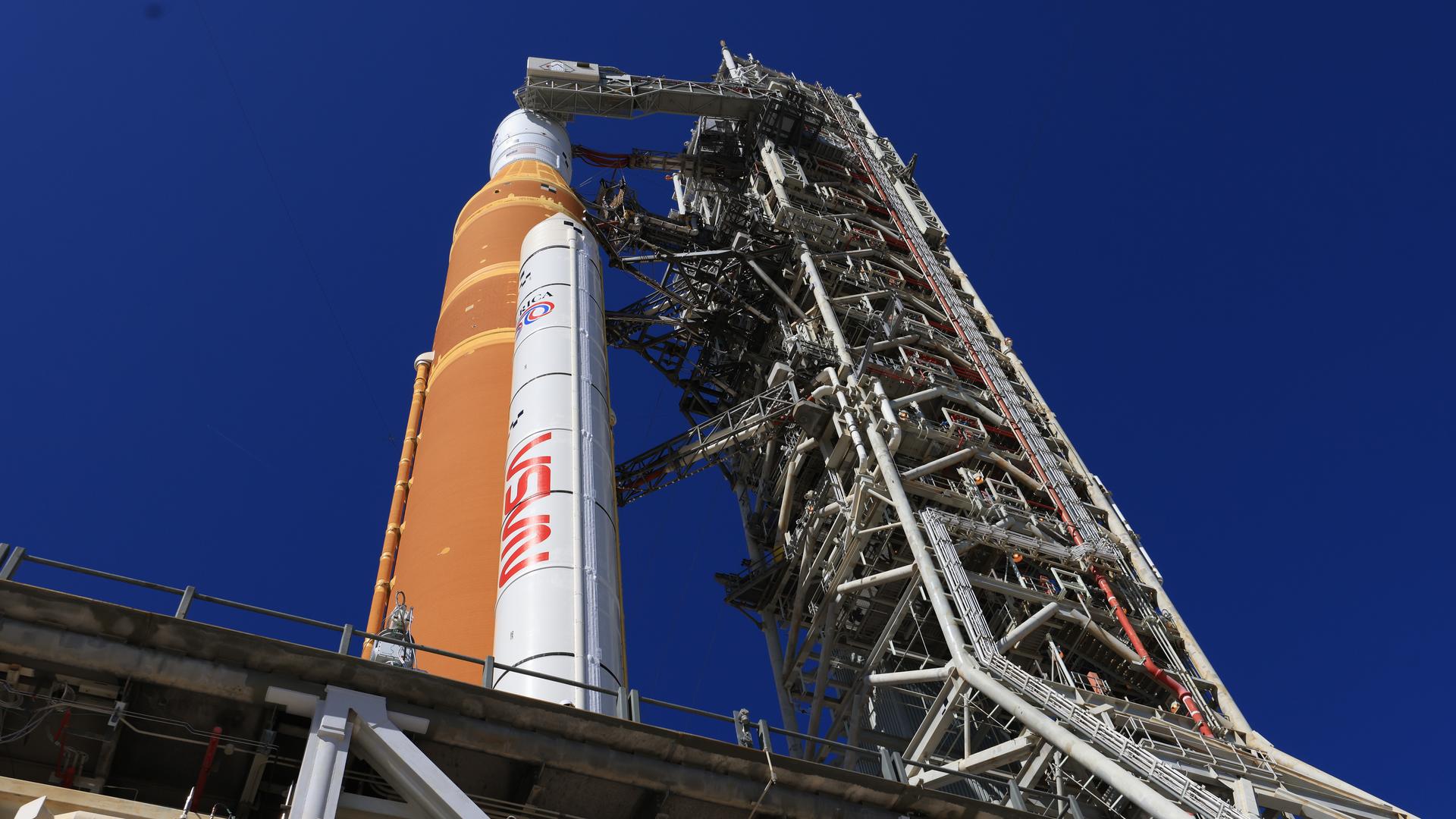 A side view shows one of the twin SLS (Space Launch System) solid rocket boosters, core stage, Orion spacecraft, and launch abort system of NASA’s Artemis II rocket at Launch Complex 39B at NASA’s Kennedy Space Center in Florida on Tuesday, Feb. 10, 2026. The Artemis II test flight will take Commander Reid Wiseman, Pilot Victor Glover, and Mission Specialist Christina Koch from NASA, and Mission Specialist Jeremy Hansen from the CSA (Canadian Space Agency), around the Moon and back to Earth.