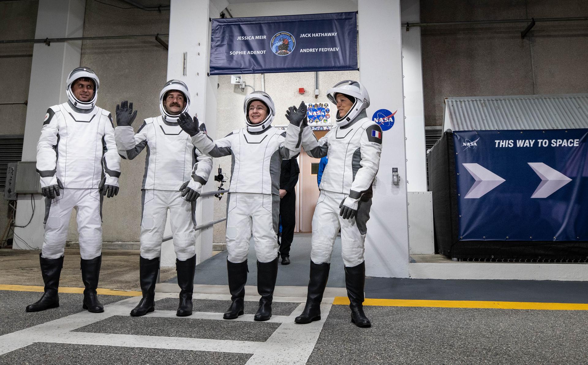 NASA’s SpaceX Crew-12 crew members wave to family and friends as they depart the Neil A. Armstrong Operations and Checkout Building at the agency’s Kennedy Space Center in Florida for Space Launch Complex 40 at Cape Canaveral Space Force Station ahead of launch on Friday, Feb. 13, 2026. From left, Roscosmos cosmonaut Andrey Fedyaev, NASA astronauts Jack Hathaway and Jessica Meir, and ESA (European Space Agency) astronaut Sophie Adenot are scheduled to lift off aboard SpaceX’s Dragon spacecraft and Falcon 9 rocket to the International Space Station at 5:15 a.m. EST.