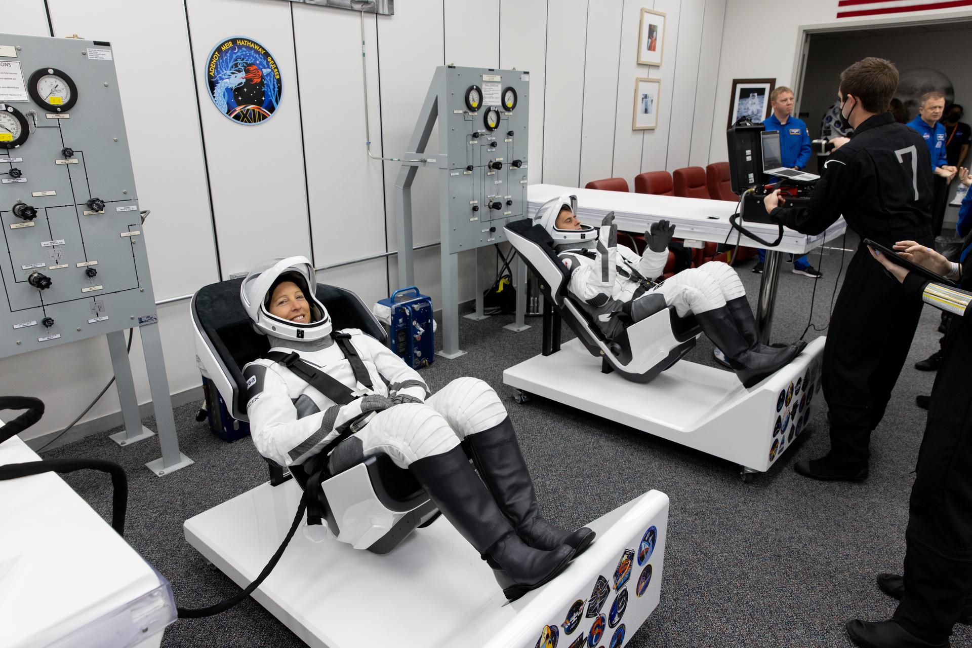 ESA (European Space Agency) astronaut Sophie Adenot (left) and Roscosmos cosmonaut Andrey Fedyaev conduct leak checks for their SpaceX spacesuits inside the crew suit-up room in the Neil A. Armstrong Operations and Checkout Building at the agency’s Kennedy Space Center in Florida ahead of launch of NASA’s SpaceX Crew-12 mission to the International Space Station on Friday, Feb. 13, 2026. Meir and fellow NASA astronaut Jack Hathaway, along with ESA (European Space Agency) astronaut Sophie Adenot, and Roscosmos cosmonaut Andrey Fedyaev are scheduled to lift off aboard SpaceX’s Dragon spacecraft and Falcon 9 rocket at 5:15 a.m. EST, from Space Launch Complex 40 at Cape Canaveral Space Force Station in Florida.