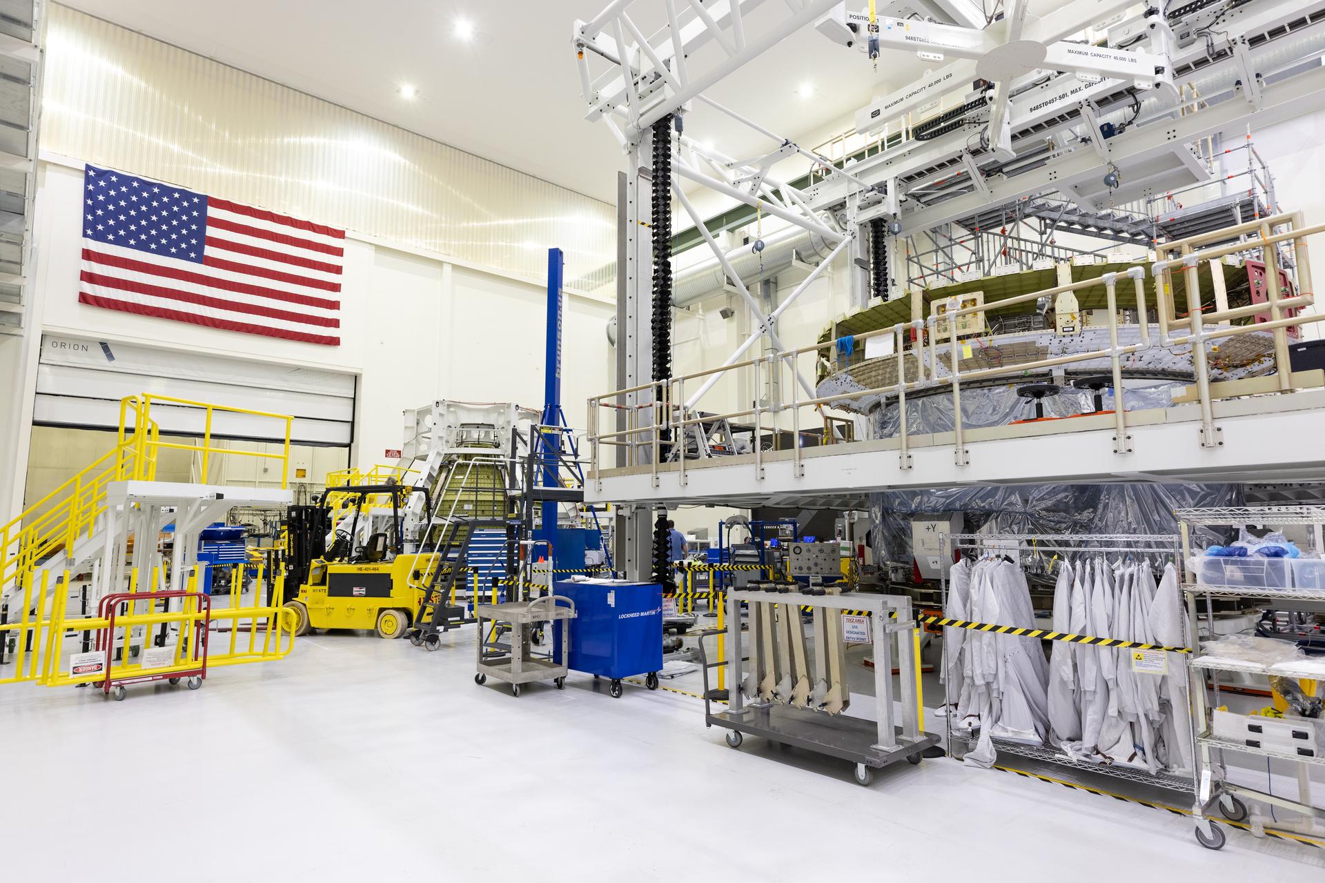 The European Service Module and crew module adapter for NASA’s Artemis IV mission is seen on a work stand on the right, while the Orion crew module for the agency’s Artemis V mission can be seen in the background inside the high bay of the Neil A. Armstrong Operations and Checkout Building at NASA’s Kennedy Space Center in Florida on Tuesday, Feb. 17, 2026. The Orion crew module is the astronaut habitat and reentry capsule, while the European Service Module provides propulsion, power, and life-support resources during Artemis missions. Under Artemis, NASA will send astronauts on increasingly difficult missions to explore more of the Moon for scientific discovery, economic benefits, and to build on our foundation for the first crewed missions to Mars.