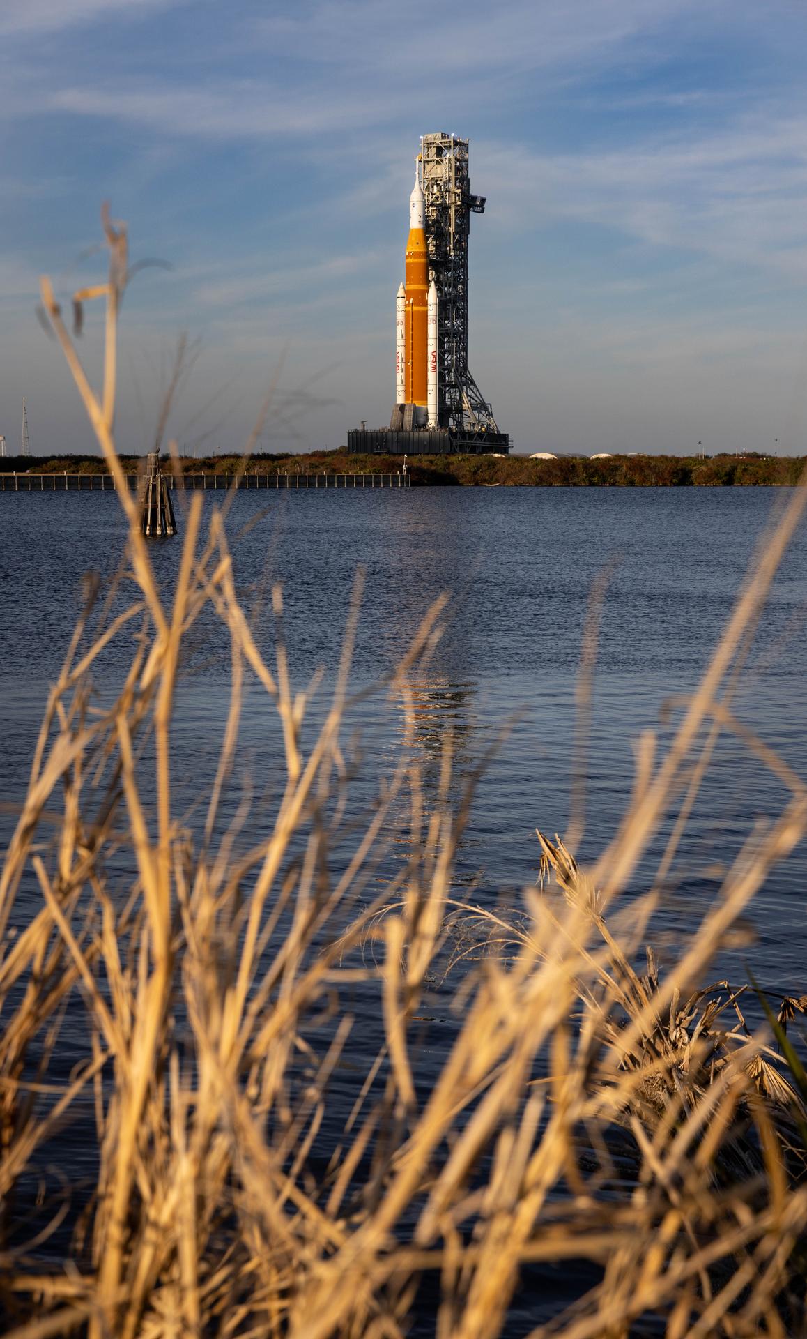 NASA’s crawler-transporter 2, carrying NASA’s Artemis II SLS (Space Launch System) rocket with the Orion spacecraft secured to mobile launcher 1, rolls back Wednesday, Feb. 25, 2026, to the Vehicle Assembly Building at NASA’s Kennedy Space Center in Florida to troubleshoot the flow of helium to the rocket’s upper stage, the interim cryogenic propulsion stage. Once complete, the SLS rocket will roll back to Launch Complex 39B to prepare to launch four astronauts around the Moon and back for the Artemis II test flight. 