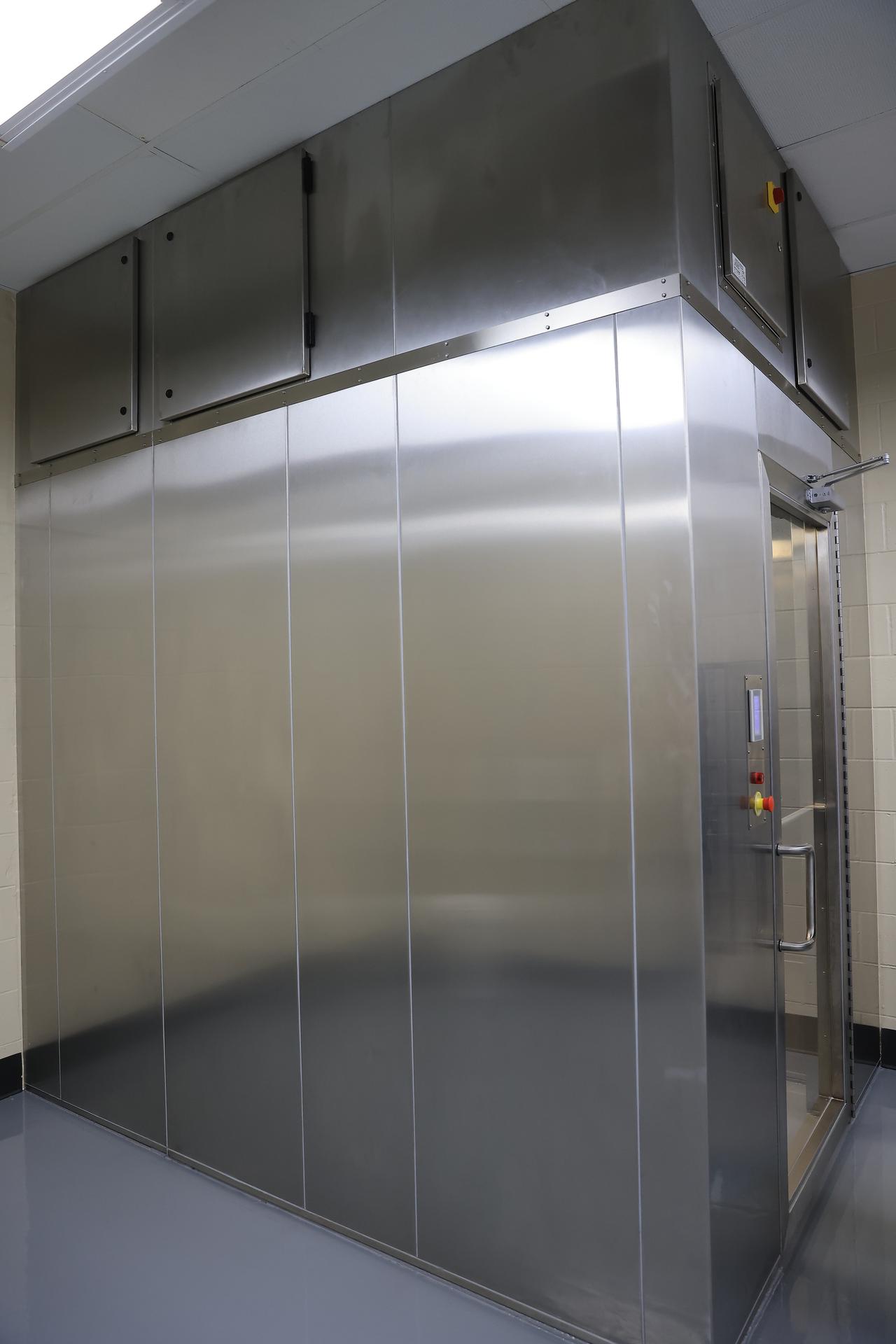 This image shows the recently upgraded air showers which blast high-velocity HEPA-filtered air onto people before they enter a clean room at NASA’s Payload Hazardous Servicing Facility at the agency’s Kennedy Space Center in Florida on Friday, Feb. 27, 2026. The PHSF went through several upgrades ahead of the arrival of Nancy Grace Roman Space Telescope. Roman will provide deep, panoramic views of the cosmos, generating never-before-seen pictures that will revolutionize our understanding of the universe. Roman will undergo several prelaunch operations, including thermal protection closeout, cleaning, solar array work, and loading hydrazine propellant.  