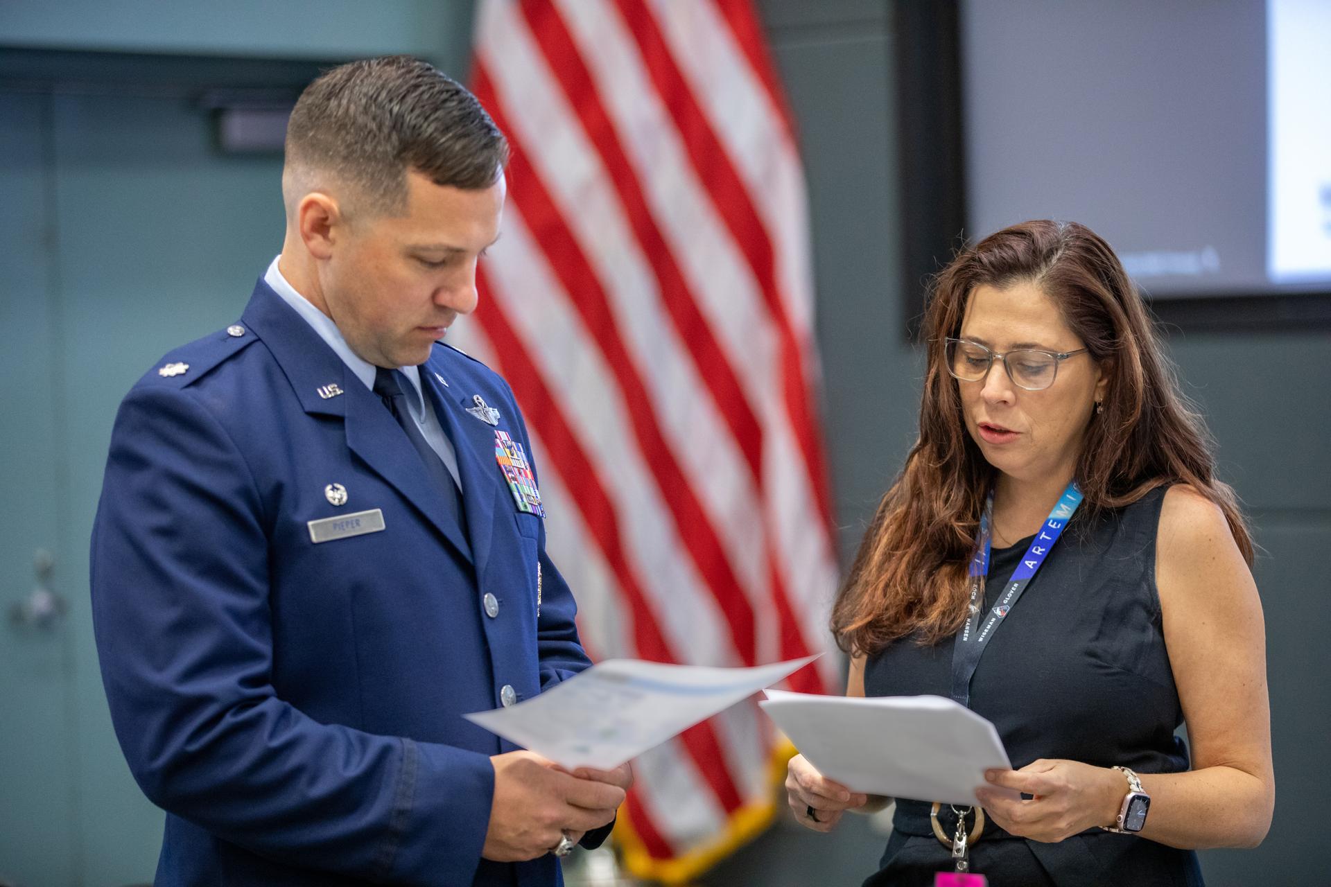 From left, Lieutenant Colonel Kevin M. Pieper, 1st Air Force, Detachment 3 at Patrick Space Force Base in Florida and Lili Villarreal, Artemis II landing and recovery director in Exploration Ground Systems Program at NASA’s Kennedy Space Center in Florida, participate in the Artemis II Flight Readiness Review with NASA leadership on Wednesday, March 11, 2026, at NASA Kennedy. The review is an assessment of the readiness of NASA’s SLS (Space Launch System) rocket and Orion spacecraft to support the Artemis II test flight as four astronauts journey around the Moon and return to Earth. 