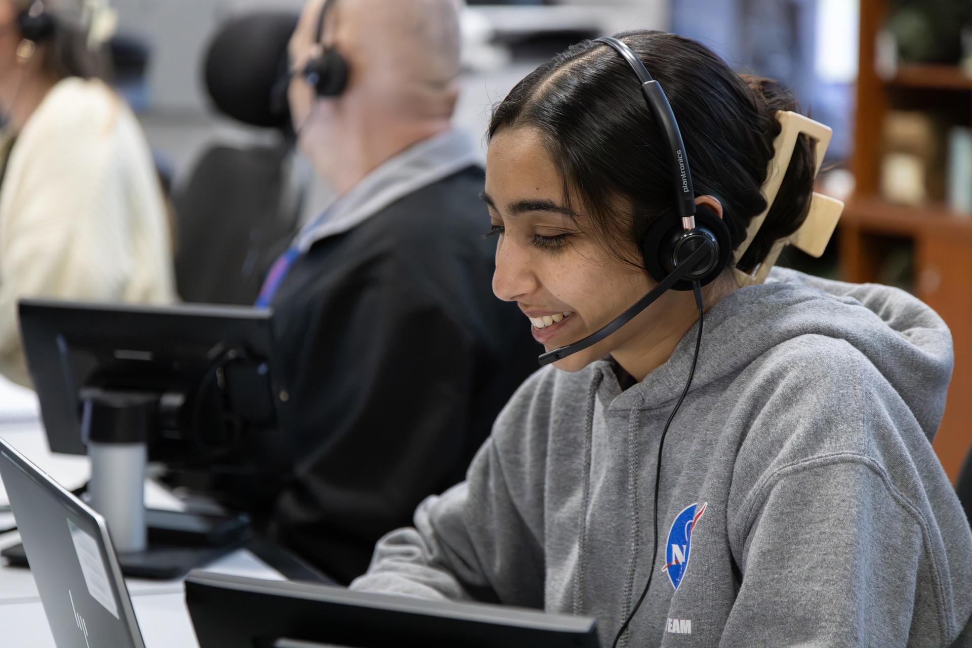 An Artemis launch team member, seen inside Firing Room 1 of the Rocco A. Petrone Launch Control Center, participates in the rollout of the Artemis II SLS (Space Launch System) rocket and Orion spacecraft from the Vehicle Assembly Building to Launch Complex 39B at NASA’s Kennedy Space Center in Florida on Friday, March 20, 2026. The Artemis II test flight will take Commander Reid Wiseman, Pilot Victor Glover, and Mission Specialist Christina Koch from NASA, and Mission Specialist Jeremy Hansen from the CSA (Canadian Space Agency), around the Moon and back to Earth with launch opportunities beginning in April 2026.
