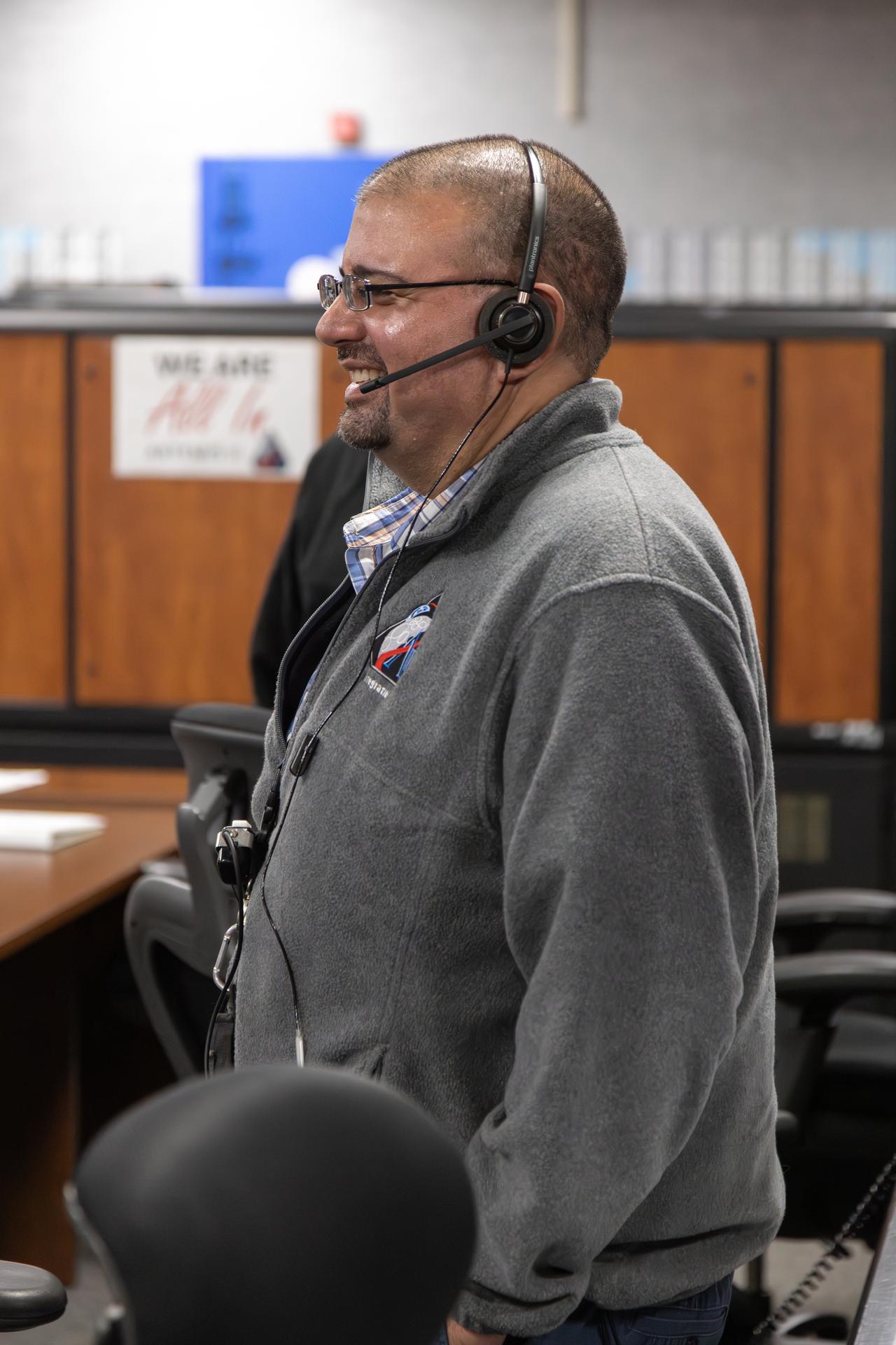 An Artemis launch team member, seen inside Firing Room 1 of the Rocco A. Petrone Launch Control Center, participates in the rollout of the Artemis II SLS (Space Launch System) rocket and Orion spacecraft from the Vehicle Assembly Building to Launch Complex 39B at NASA’s Kennedy Space Center in Florida on Friday, March 20, 2026. The Artemis II test flight will take Commander Reid Wiseman, Pilot Victor Glover, and Mission Specialist Christina Koch from NASA, and Mission Specialist Jeremy Hansen from the CSA (Canadian Space Agency), around the Moon and back to Earth with launch opportunities beginning in April 2026.
