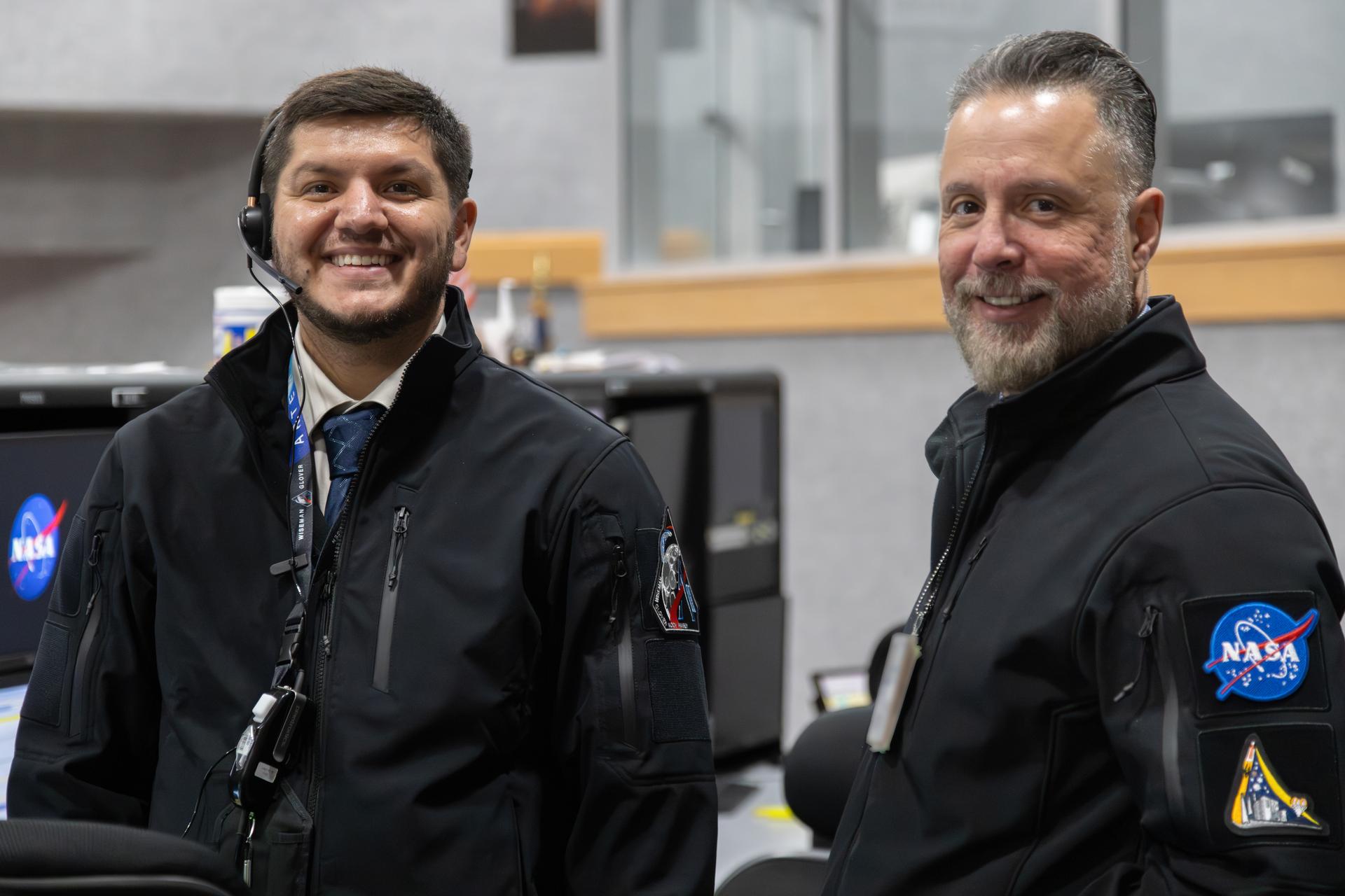 Artemis launch team members pose for a photograph inside Firing Room 1 of the Rocco A. Petrone Launch Control Center, during the rollout of the Artemis II SLS (Space Launch System) rocket and Orion spacecraft from the Vehicle Assembly Building to Launch Complex 39B at NASA’s Kennedy Space Center in Florida on Friday, March 20, 2026. The Artemis II test flight will take Commander Reid Wiseman, Pilot Victor Glover, and Mission Specialist Christina Koch from NASA, and Mission Specialist Jeremy Hansen from the CSA (Canadian Space Agency), around the Moon and back to Earth with launch opportunities beginning in April 2026.
