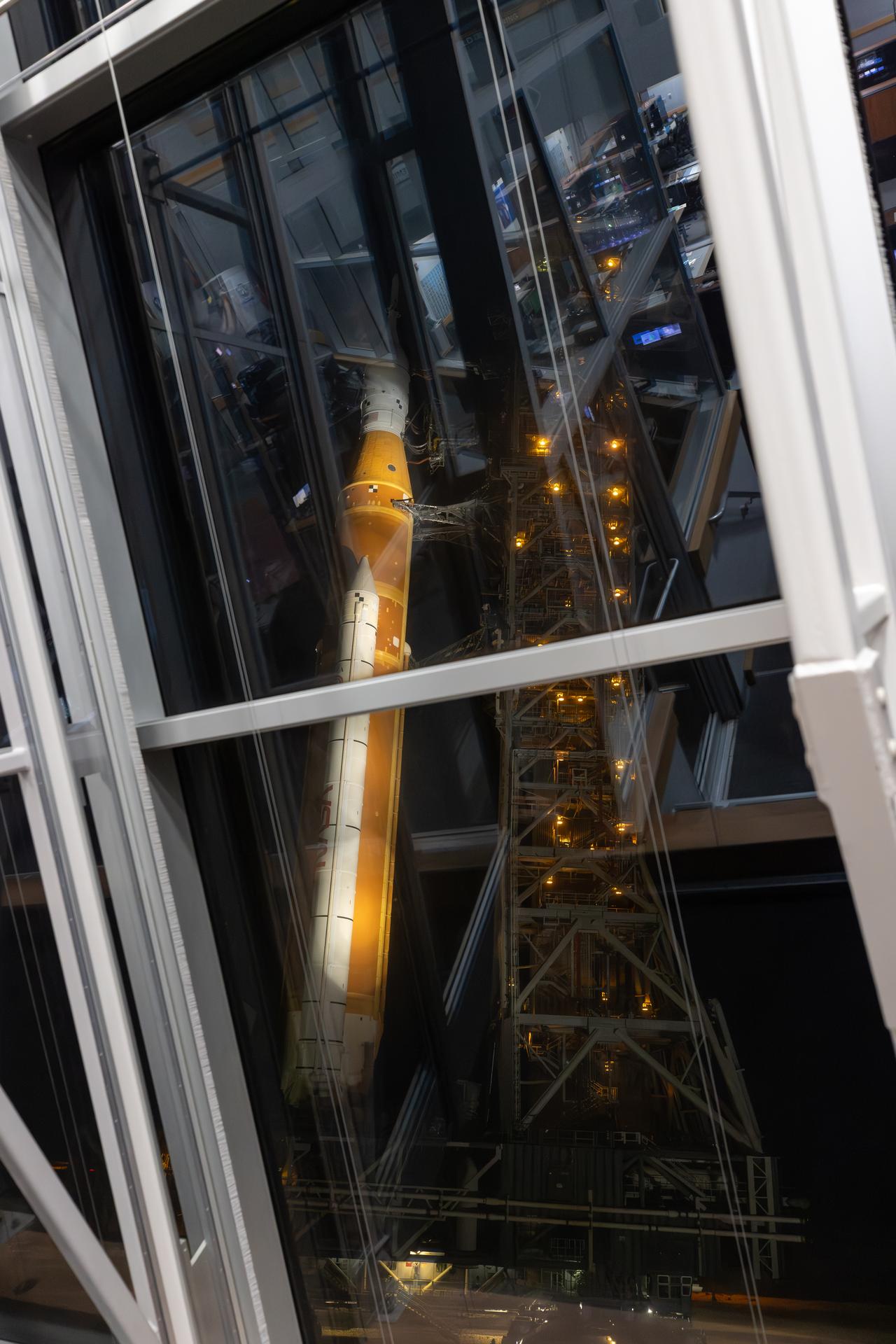 Artemis launch team members pose for a photograph inside Firing Room 1 of the Rocco A. Petrone Launch Control Center, during the rollout of the Artemis II SLS (Space Launch System) rocket and Orion spacecraft from the Vehicle Assembly Building to Launch Complex 39B at NASA’s Kennedy Space Center in Florida on Friday, March 20, 2026. The Artemis II test flight will take Commander Reid Wiseman, Pilot Victor Glover, and Mission Specialist Christina Koch from NASA, and Mission Specialist Jeremy Hansen from the CSA (Canadian Space Agency), around the Moon and back to Earth with launch opportunities beginning in April 2026.