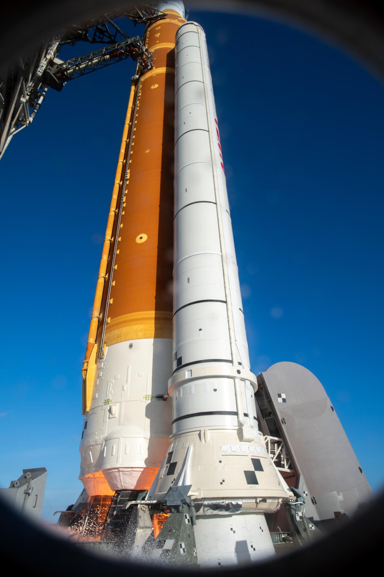 The Ignition Overpressure Protection and Sound Suppression water deluge system activates during launch of NASA’s Artemis II test flight at Launch Complex 39B at NASA’s Kennedy Space Center in Florida at 6:35 p.m. EDT on Wednesday, April 1, 2026. The water deluge system releases about 450,000 gallons of water across the mobile launcher and flame deflector to reduce the extreme heat and energy generated by the rocket during ignition and liftoff. Artemis II Commander Reid Wiseman, Pilot Victor Glover, and Mission Specialist Christina Koch from NASA, along with Mission Specialist Jeremy Hansen from the CSA (Canadian Space Agency), are on a 10-day journey around the Moon and back with splashdown in the Pacific Ocean off the coast of San Diego, California on Friday, April 10.