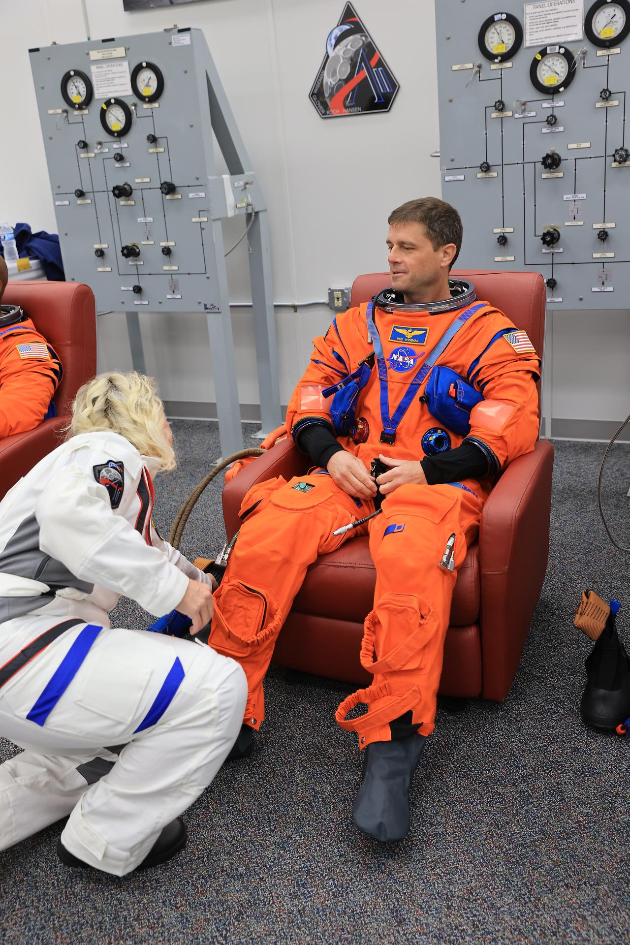 NASA astronaut Reid Wiseman, Artemis II commander, conducts leak checks on his spacesuit inside the crew suit-up room in the Neil A. Armstrong Operations and Checkout Building at the agency’s Kennedy Space Center in Florida on Wednesday, April 1, 2026, ahead of the Artemis II test flight. The mission will take Wiseman, Pilot Victor Glover, and Mission Specialist Christina Koch from NASA, along with Mission Specialist Jeremy Hansen from the CSA (Canadian Space Agency), on a 10-day journey around the Moon and back aboard NASA’s SLS (Space Launch System) rocket and Orion spacecraft with a two hour launch window opening at 6:24 p.m. EDT from Launch Complex 39B at NASA Kennedy.