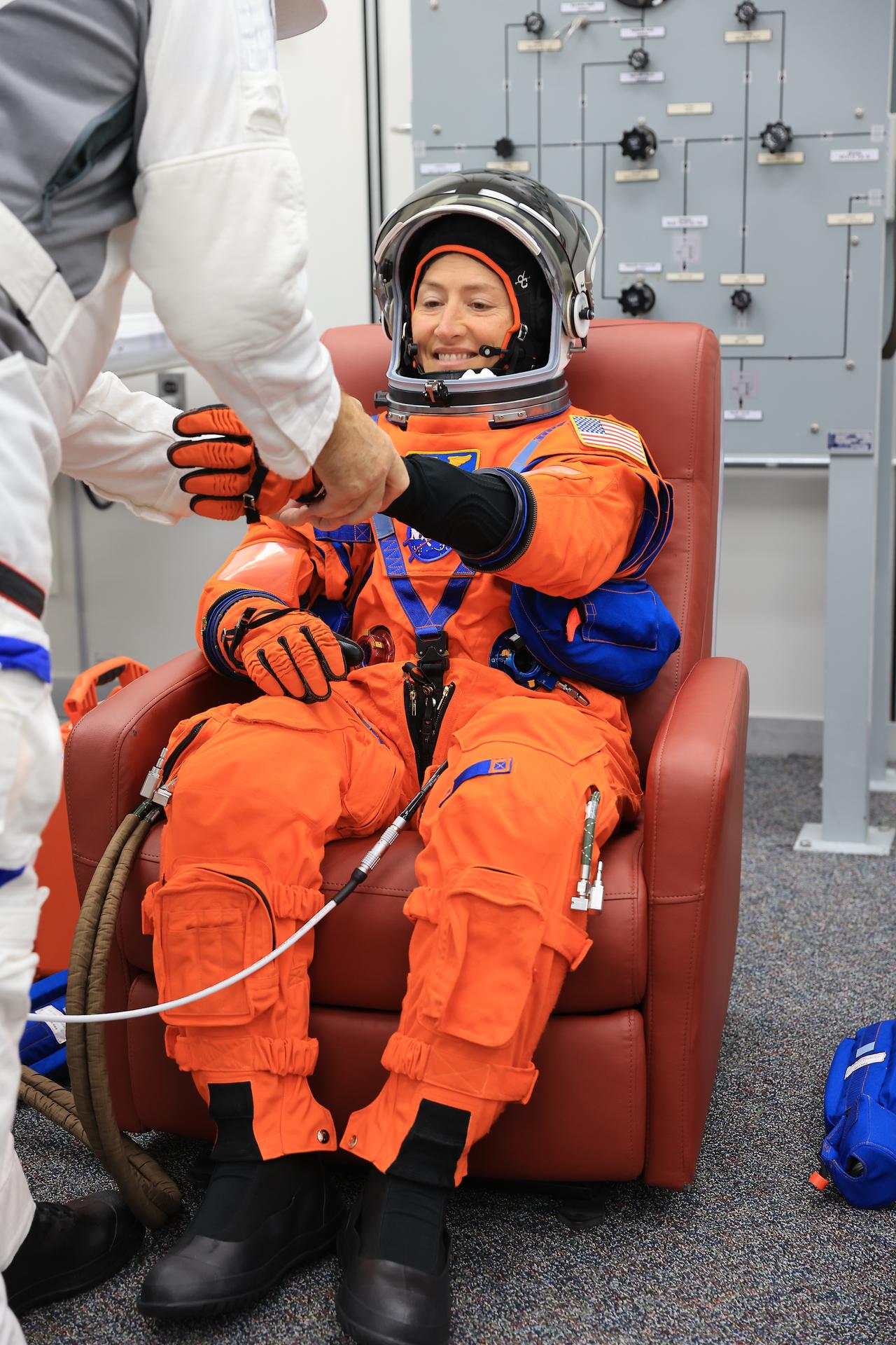 NASA astronaut Christina Koch, Artemis II mission specialist, conducts leak checks on her spacesuit inside the crew suit-up room in the Neil A. Armstrong Operations and Checkout Building at the agency’s Kennedy Space Center in Florida on Wednesday, April 1, 2026, ahead of the Artemis II test flight. The mission will take Koch, Commander Reid Wiseman, and Pilot Victor Glover, from NASA, along with Mission Specialist Jeremy Hansen from the CSA (Canadian Space Agency) on a 10-day journey around the Moon and back aboard NASA’s SLS (Space Launch System) rocket and Orion spacecraft with a two-hour launch window opening at 6:24 p.m. EDT from Launch Complex 39B at NASA Kennedy. 