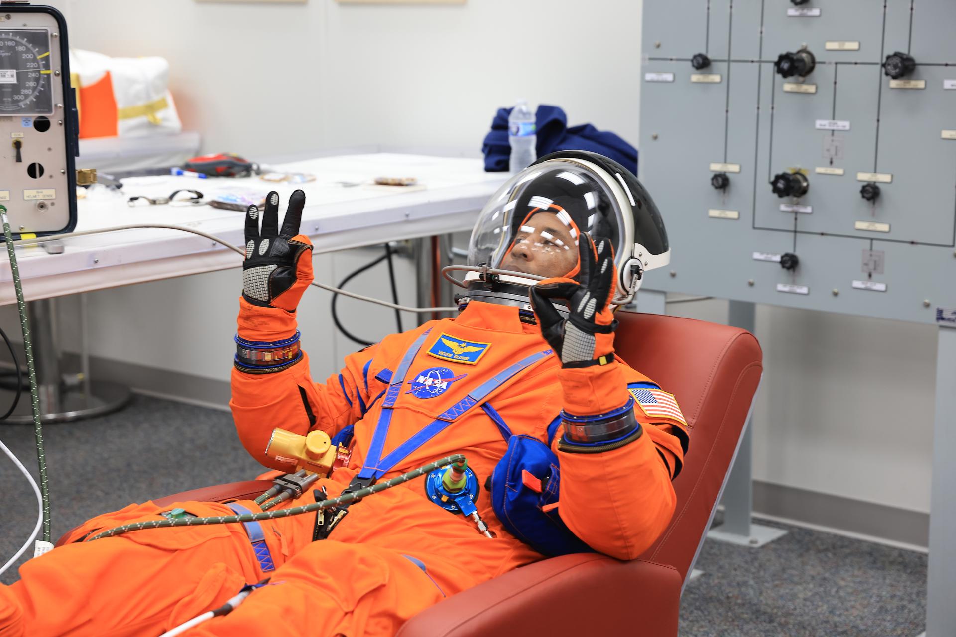 NASA astronaut Victor Glover, Artemis II pilot, conducts leak checks on his spacesuit inside the crew suit-up room in the Neil A. Armstrong Operations and Checkout Building at the agency’s Kennedy Space Center in Florida on Wednesday, April 1, 2026, ahead of the Artemis II test flight. The mission will take Pilot Victor Glover, Commander Reid Wiseman, and Mission Specialist Christina Koch from NASA, along with Mission Specialist Jeremy Hansen from the CSA (Canadian Space Agency) on a 10-day journey around the Moon and back aboard NASA’s SLS (Space Launch System) rocket and Orion spacecraft with a two hour launch window opening at 6:24 p.m. EDT from Launch Complex 39B at NASA Kennedy. 