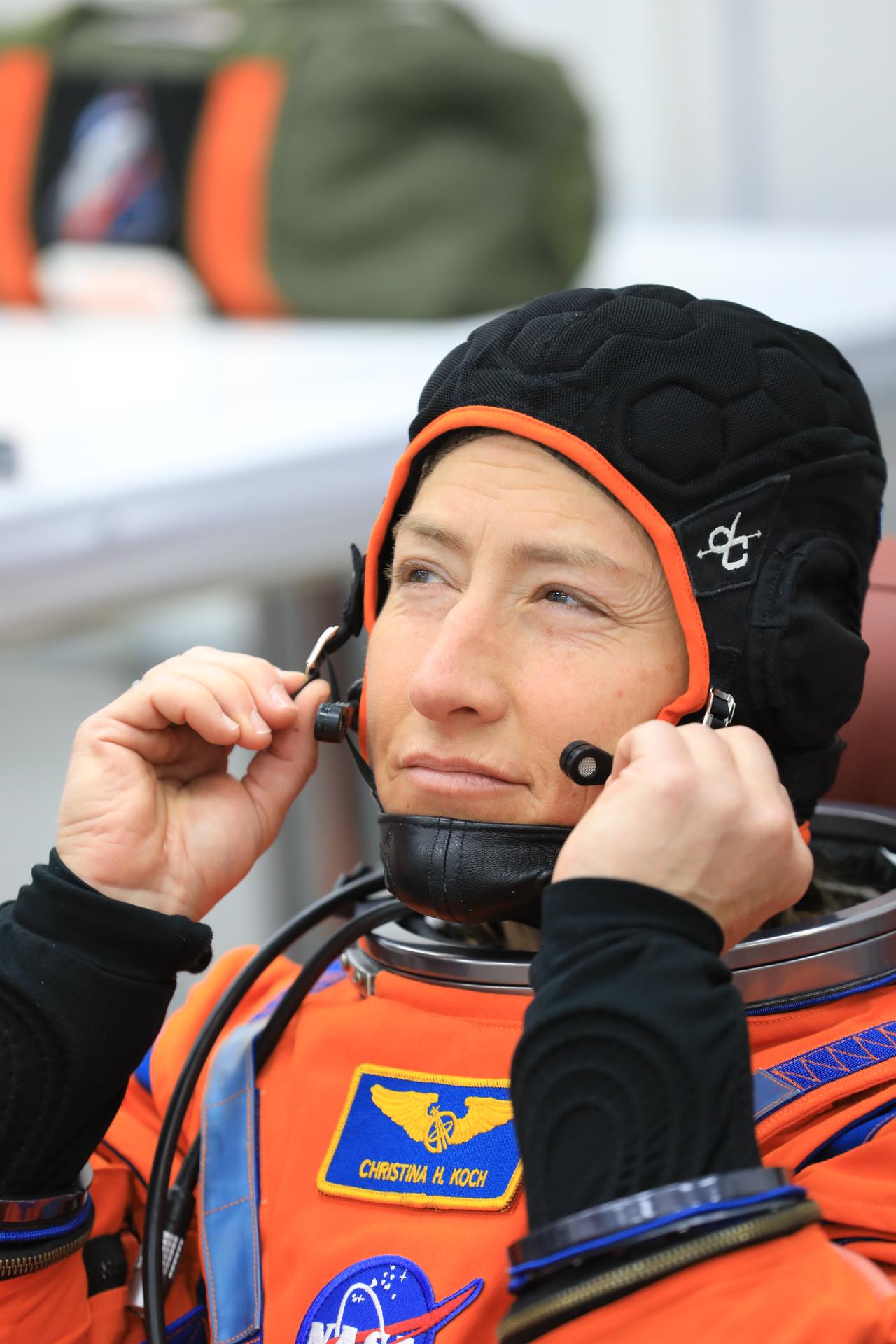 NASA astronaut Christina Koch, Artemis II mission specialist, conducts leak checks on her spacesuit inside the crew suit-up room in the Neil A. Armstrong Operations and Checkout Building at the agency’s Kennedy Space Center in Florida on Wednesday, April 1, 2026, ahead of the Artemis II test flight. The mission will take Koch, Commander Reid Wiseman, and Pilot Victor Glover, from NASA, along with Mission Specialist Jeremy Hansen from the CSA (Canadian Space Agency) on a 10-day journey around the Moon and back aboard NASA’s SLS (Space Launch System) rocket and Orion spacecraft with a two-hour launch window opening at 6:24 p.m. EDT from Launch Complex 39B at NASA Kennedy. 