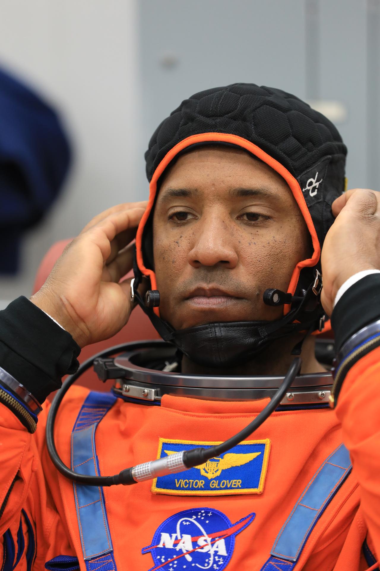 NASA astronaut Victor Glover, Artemis II pilot, conducts leak checks on his spacesuit inside the crew suit-up room in the Neil A. Armstrong Operations and Checkout Building at the agency’s Kennedy Space Center in Florida on Wednesday, April 1, 2026, ahead of the Artemis II test flight. The mission will take Pilot Victor Glover, Commander Reid Wiseman, and Mission Specialist Christina Koch from NASA, along with Mission Specialist Jeremy Hansen from the CSA (Canadian Space Agency) on a 10-day journey around the Moon and back aboard NASA’s SLS (Space Launch System) rocket and Orion spacecraft with a two hour launch window opening at 6:24 p.m. EDT from Launch Complex 39B at NASA Kennedy.