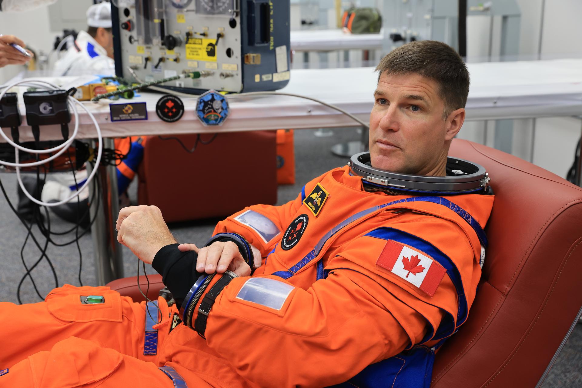 CSA (Canadian Space Agency) astronaut Jeremy Hansen, Artemis II mission specialist, conducts leak checks on his spacesuit inside the crew suit-up room in the Neil A. Armstrong Operations and Checkout Building at the agency’s Kennedy Space Center in Florida on Wednesday, April 1, 2026, ahead of the Artemis II test flight. The mission will take Hansen, Commander Reid Wiseman, Pilot Victor Glover, and Mission Specialist Christina Koch, from NASA, on a 10-day journey around the Moon and back aboard NASA’s SLS (Space Launch System) rocket and Orion spacecraft with a two-hour launch window opening at 6:24 p.m. EDT from Launch Complex 39B at NASA Kennedy.
