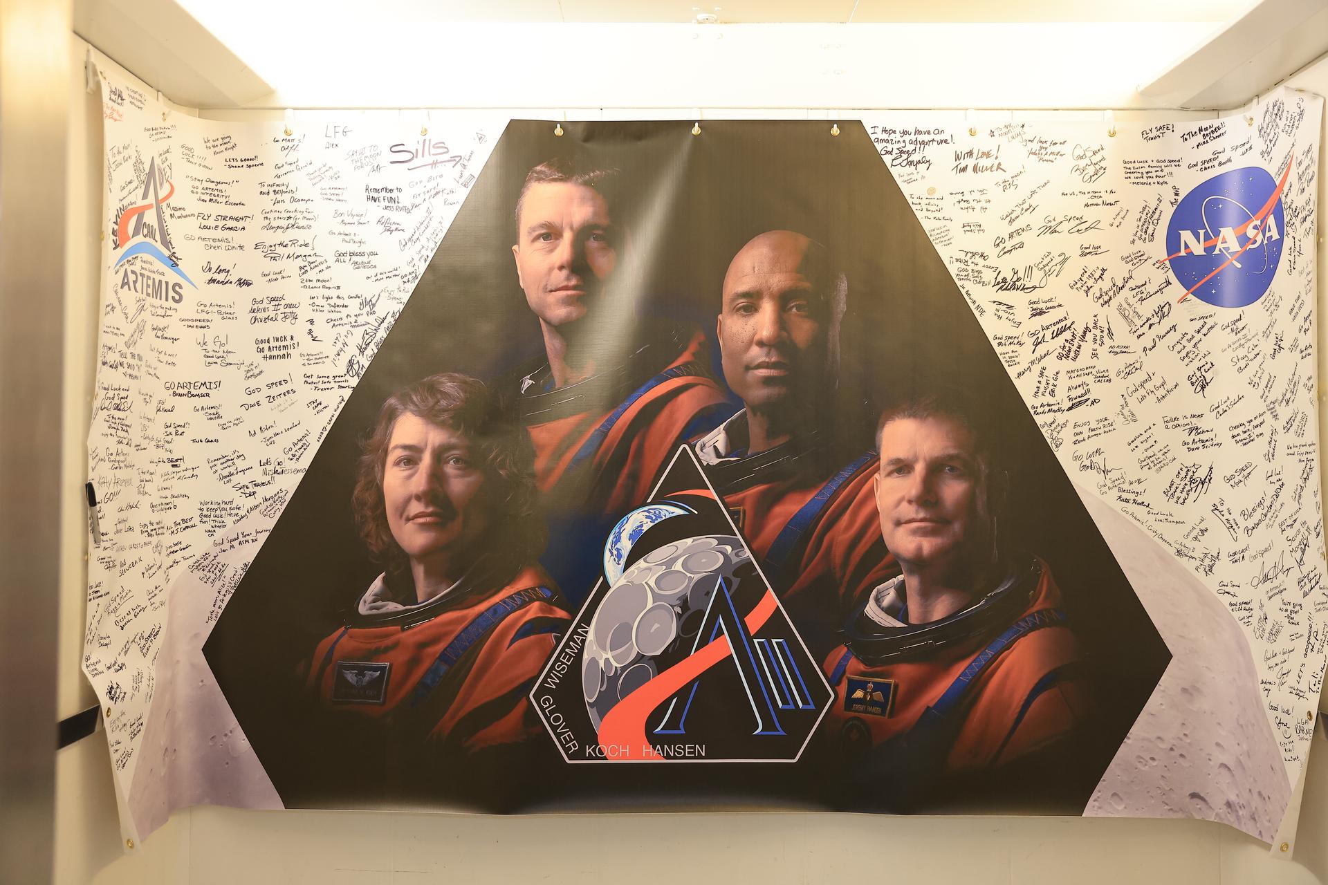 The Artemis II mission insignia is displayed with employee signatures inside the Neil A. Armstrong Operations and Checkout Building at the agency’s Kennedy Space Center in Florida on Wednesday, April 1, 2026, ahead of the Artemis II test flight. The mission will take Artemis II Commander Reid Wiseman, Pilot Victor Glover, and Mission Specialist Christina Koch from NASA, along with Mission Specialist Jeremy Hansen from the CSA (Canadian Space Agency), on a 10-day journey around the Moon and back aboard NASA’s SLS (Space Launch System) rocket and Orion spacecraft with a two hour launch window opening at 6:24 p.m. EDT from Launch Complex 39B at NASA Kennedy. 