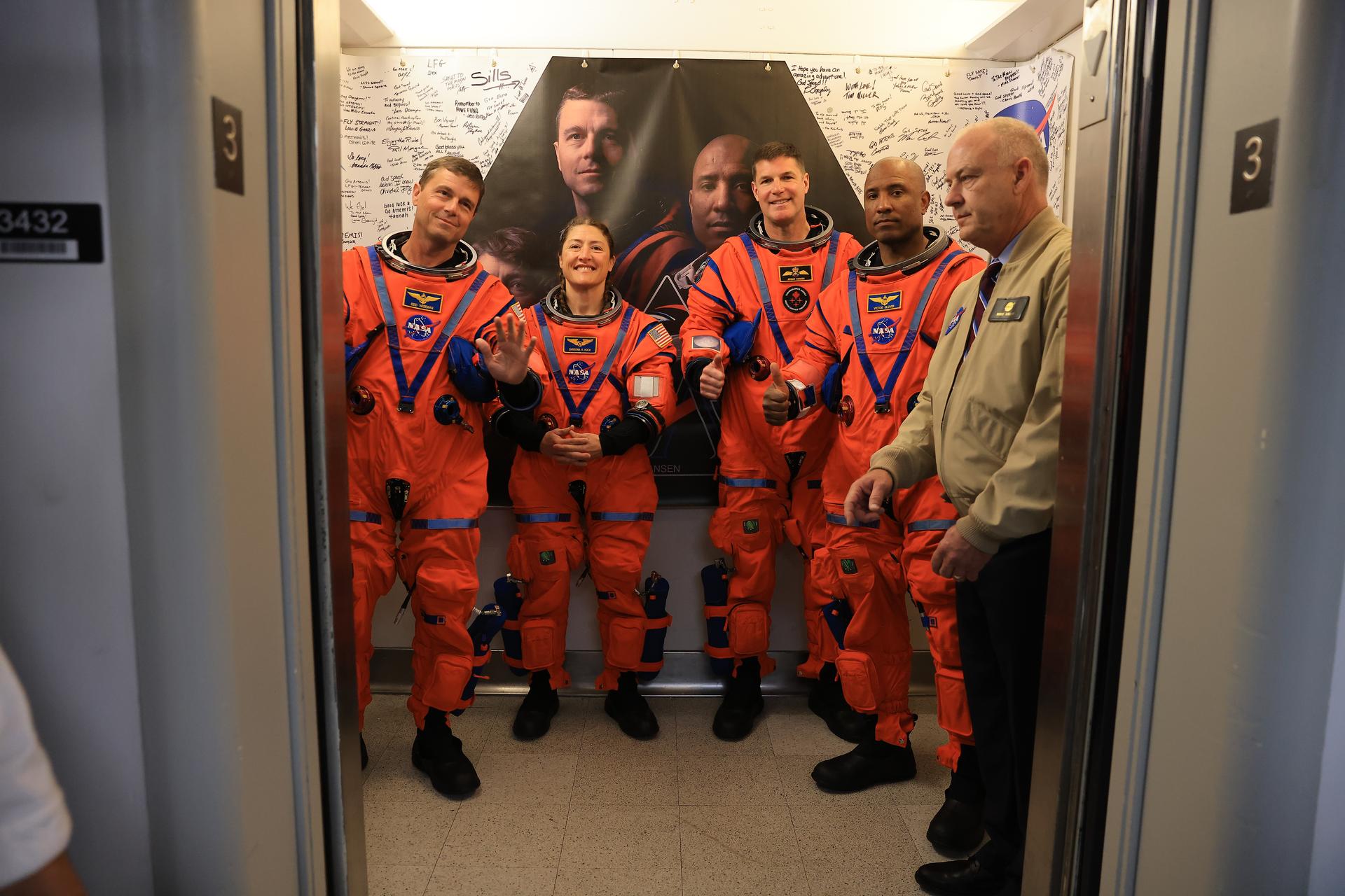 From left, Artemis II Commander Reid Wiseman, Mission Specialist Christina Koch, and Mission Specialist Jeremy Hansen, from the CSA (Canadian Space Agency), along with Pilot Victor Glover, from NASA, board the elevator to walk out of the Neil A. Armstrong Operations and Checkout Building at the agency’s Kennedy Space Center in Florida on Wednesday, April 1, 2026, ahead of the Artemis II test flight. The mission will take the Artemis II crew on a 10-day journey around the Moon and back aboard NASA’s SLS (Space Launch System) rocket and Orion spacecraft with a two hour launch window opening at 6:24 p.m. EDT from Launch Complex 39B at NASA Kennedy. 