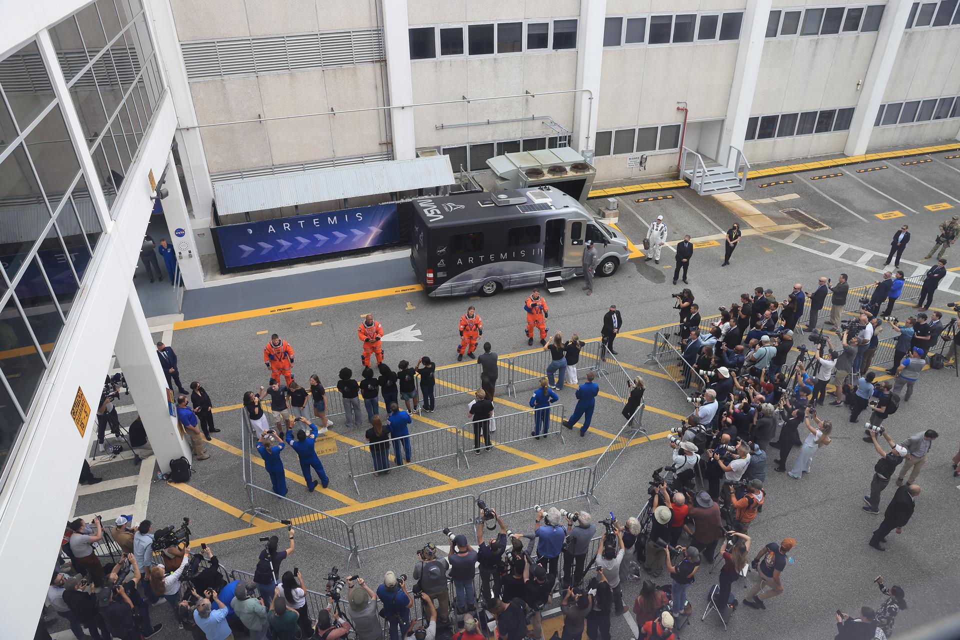 Artemis II crew members wave to family and friends as they prepare to depart the Neil A. Armstrong Operations and Checkout Building for Launch Pad 39B at the agency’s Kennedy Space Center in Florida on Wednesday, April 1, 2026, ahead of the Artemis II test flight. The mission will take Artemis II Commander Reid Wiseman, Pilot Victor Glover, and Mission Specialist Christina Koch from NASA, along with Mission Specialist Jeremy Hansen from the CSA (Canadian Space Agency), on a 10-day journey around the Moon and back aboard NASA’s SLS (Space Launch System) rocket and Orion spacecraft with a two hour launch window opening at 6:24 p.m. EDT from Launch Complex 39B at NASA Kennedy.    
