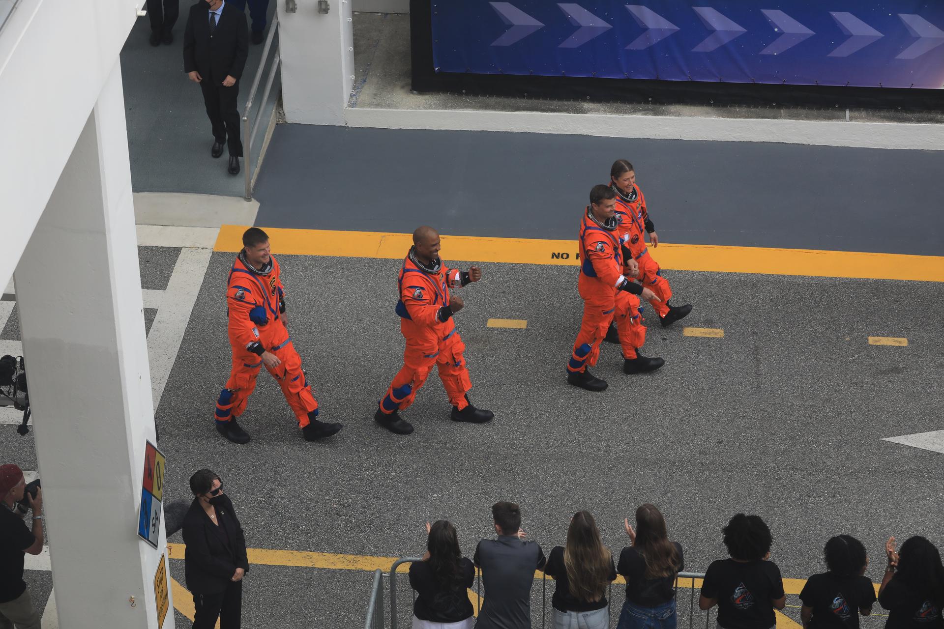 Artemis II crew members wave to family and friends as they prepare to depart the Neil A. Armstrong Operations and Checkout Building for Launch Pad 39B at the agency’s Kennedy Space Center in Florida on Wednesday, April 1, 2026, ahead of the Artemis II test flight. The mission will take Artemis II Commander Reid Wiseman, Pilot Victor Glover, and Mission Specialist Christina Koch from NASA, along with Mission Specialist Jeremy Hansen from the CSA (Canadian Space Agency), on a 10-day journey around the Moon and back aboard NASA’s SLS (Space Launch System) rocket and Orion spacecraft with a two hour launch window opening at 6:24 p.m. EDT from Launch Complex 39B at NASA Kennedy. 
