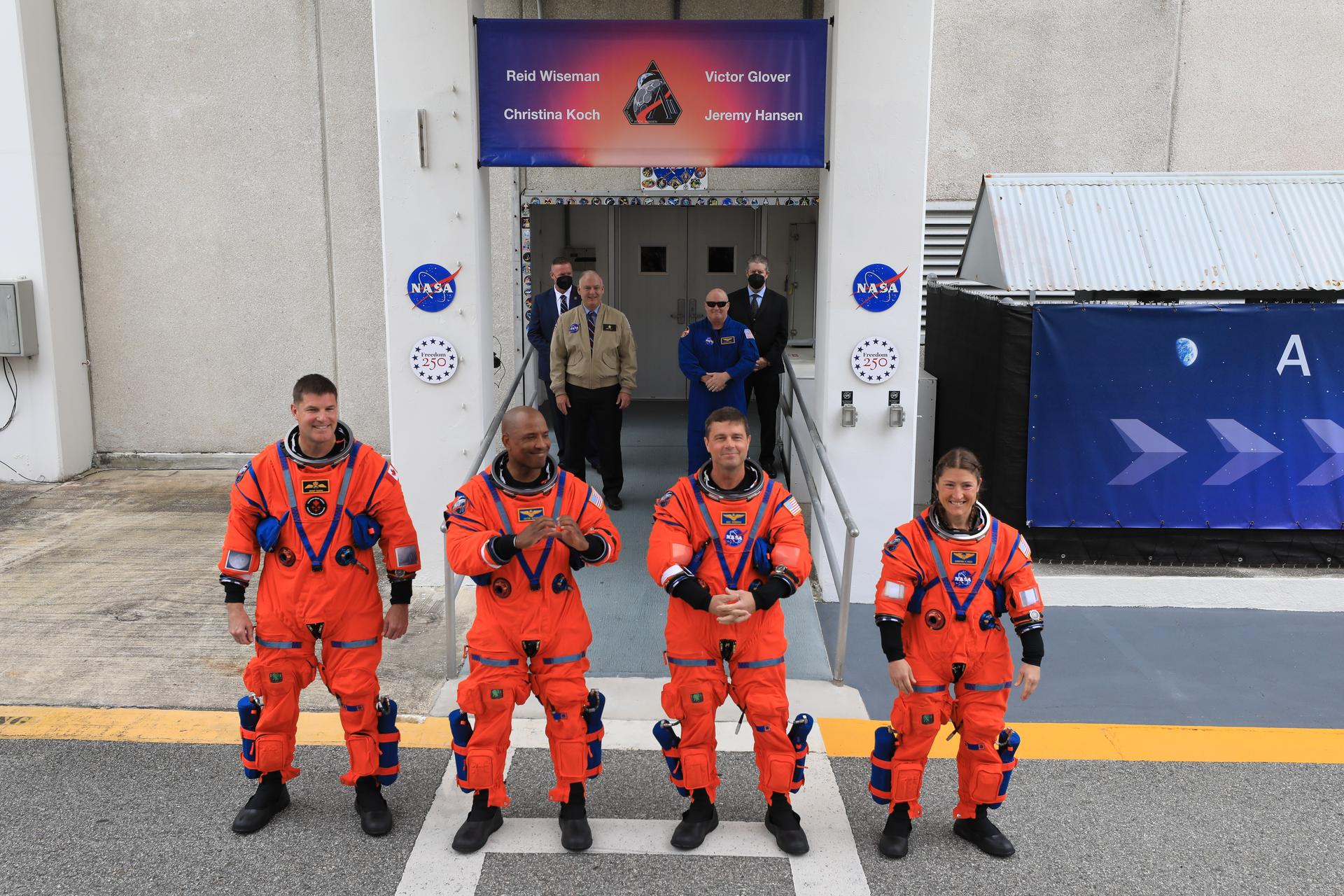 From left to right, Artemis II Mission Specialist Jeremy Hansen from the CSA (Canadian Space Agency), along with Pilot Victor Glover, Commander Reid Wiseman, and Mission Specialist Christina Koch, from NASA wave to family and friends outside the Neil A. Armstrong Operations and Checkout Building at the agency’s Kennedy Space Center in Florida on Wednesday, April 1, 2026, ahead of the Artemis II test flight. The mission will take the Artemis II crew on a 10-day journey around the Moon and back aboard NASA’s SLS (Space Launch System) rocket and Orion spacecraft with a two hour launch window opening at 6:24 p.m. EDT from Launch Complex 39B at NASA Kennedy. 