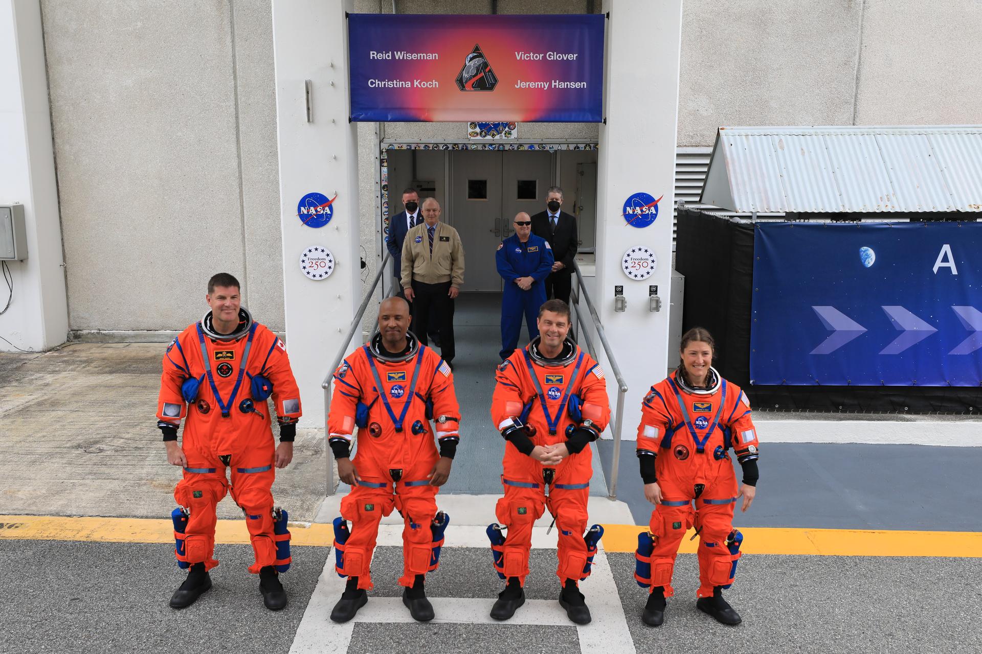 From left to right, Artemis II Mission Specialist Jeremy Hansen from the CSA (Canadian Space Agency), along with Pilot Victor Glover, Commander Reid Wiseman, and Mission Specialist Christina Koch, from NASA wave to family and friends outside the Neil A. Armstrong Operations and Checkout Building at the agency’s Kennedy Space Center in Florida on Wednesday, April 1, 2026, ahead of the Artemis II test flight. The mission will take the Artemis II crew on a 10-day journey around the Moon and back aboard NASA’s SLS (Space Launch System) rocket and Orion spacecraft with a two hour launch window opening at 6:24 p.m. EDT from Launch Complex 39B at NASA Kennedy. 
