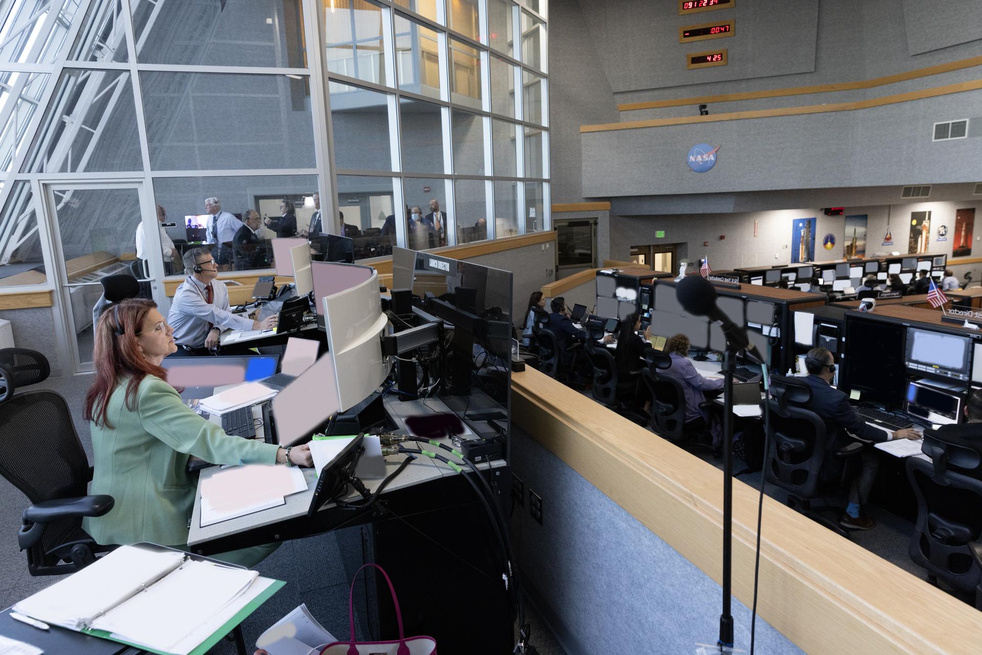From left, Jeremy Graeber, assistant launch director, and Charlie Blackwell-Thompson, Artemis launch director, each from NASA’s Exploration Ground Systems Program, are seen inside Firing Room 1 of the Rocco Petrone Launch Control Center ahead of launch of the Artemis II test flight on Wednesday, April 1, 2026. The Artemis II mission launched Commander Reid Wiseman, Pilot Victor Glover, and Mission Specialist Christina Koch from NASA, and Mission Specialist Jeremy Hansen from the CSA (Canadian Space Agency), aboard NASA’s SLS (Space Launch System) rocket and Orion spacecraft to journey for 10 days around the Moon and back to Earth.