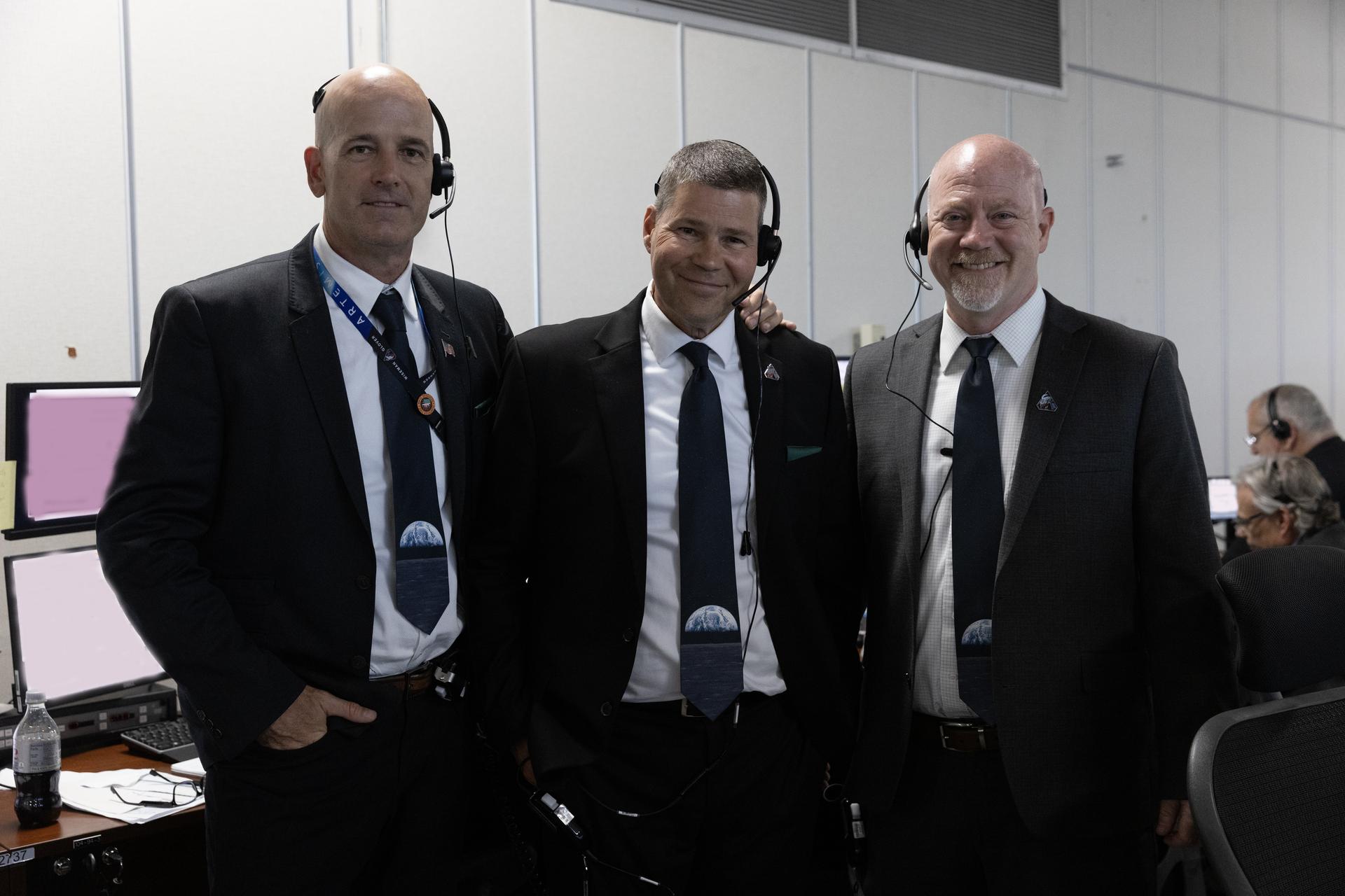 From left to right, Eric Gore, chief engineer; John Blevins, Space Launch System chief engineer; and Ronald Baccus, Orion chief engineer, each from NASA’s Exploration Ground Systems Program, pose for a photograph inside Firing Room 1 of the Rocco Petrone Launch Control Center following the launch of the Artemis II test flight on Wednesday, April 1, 2026. The tie-cutting is a NASA tradition those who have a new role launch. The Artemis II mission launched Commander Reid Wiseman, Pilot Victor Glover, and Mission Specialist Christina Koch from NASA, and Mission Specialist Jeremy Hansen from the CSA (Canadian Space Agency), aboard NASA’s SLS (Space Launch System) rocket and Orion spacecraft to journey for 10 days around the Moon and back to Earth.