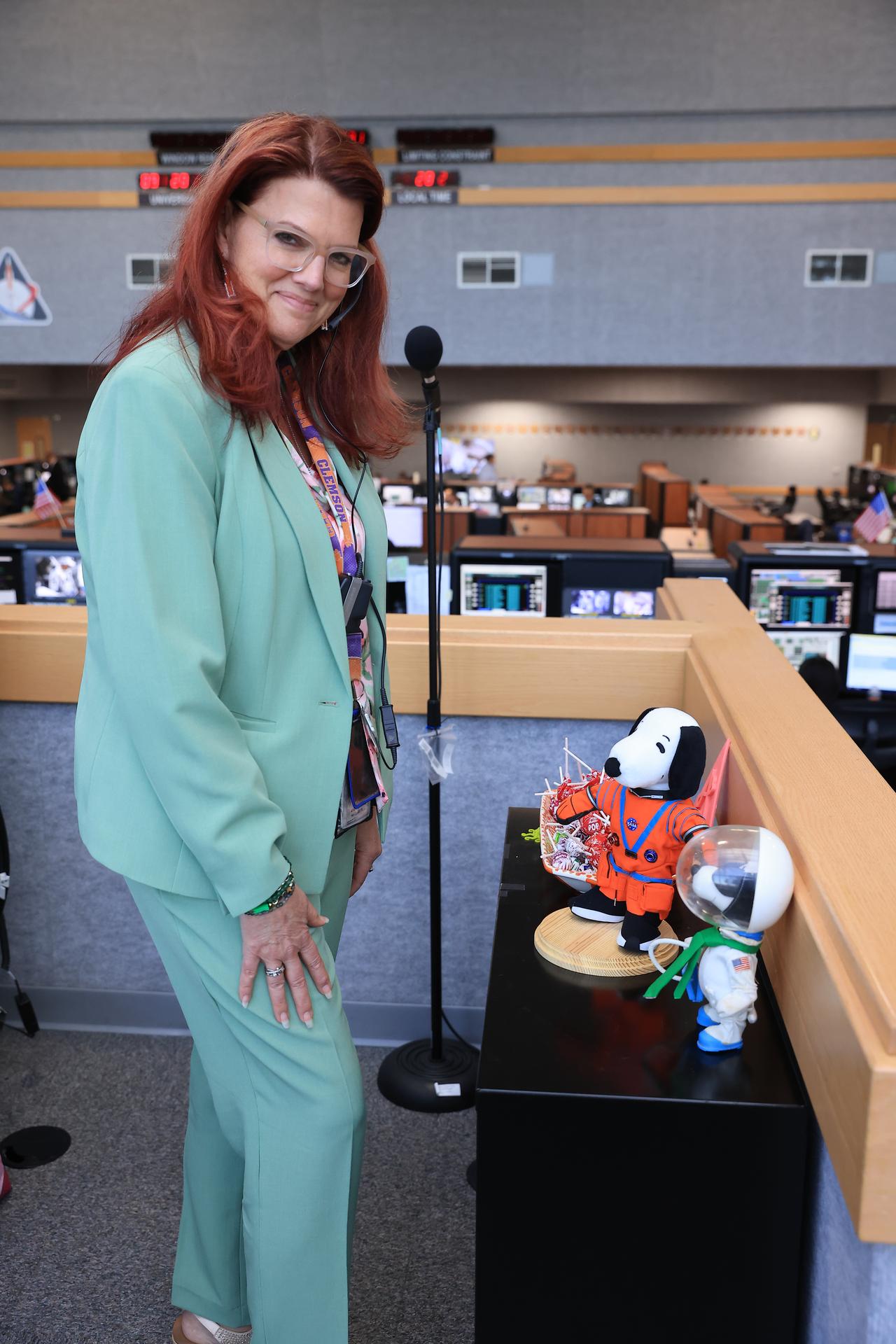 Charlie Blackwell-Thompson, Artemis launch director, NASA’s Exploration Ground Systems Program poses with an Astronaut Snoopy plush toy and her childhood Astronaut Snoopy inside Firing Room 1 of the Rocco Petrone Launch Control Center following the launch of the Artemis II test flight on Wednesday, April 1, 2026. Snoopy has been an official NASA mascot for over 50 years. The Artemis II mission launched Commander Reid Wiseman, Pilot Victor Glover, and Mission Specialist Christina Koch from NASA, and Mission Specialist Jeremy Hansen from the CSA (Canadian Space Agency), aboard NASA’s SLS (Space Launch System) rocket and Orion spacecraft to journey for 10 days around the Moon and back to Earth.