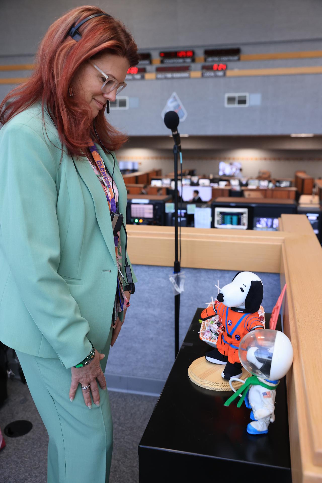 Charlie Blackwell-Thompson, Artemis launch director, NASA’s Exploration Ground Systems Program poses with an Astronaut Snoopy plush toy and her childhood Astronaut Snoopy inside Firing Room 1 of the Rocco Petrone Launch Control Center following the launch of the Artemis II test flight on Wednesday, April 1, 2026. Snoopy has been an official NASA mascot for over 50 years. The Artemis II mission launched Commander Reid Wiseman, Pilot Victor Glover, and Mission Specialist Christina Koch from NASA, and Mission Specialist Jeremy Hansen from the CSA (Canadian Space Agency), aboard NASA’s SLS (Space Launch System) rocket and Orion spacecraft to journey for 10 days around the Moon and back to Earth.