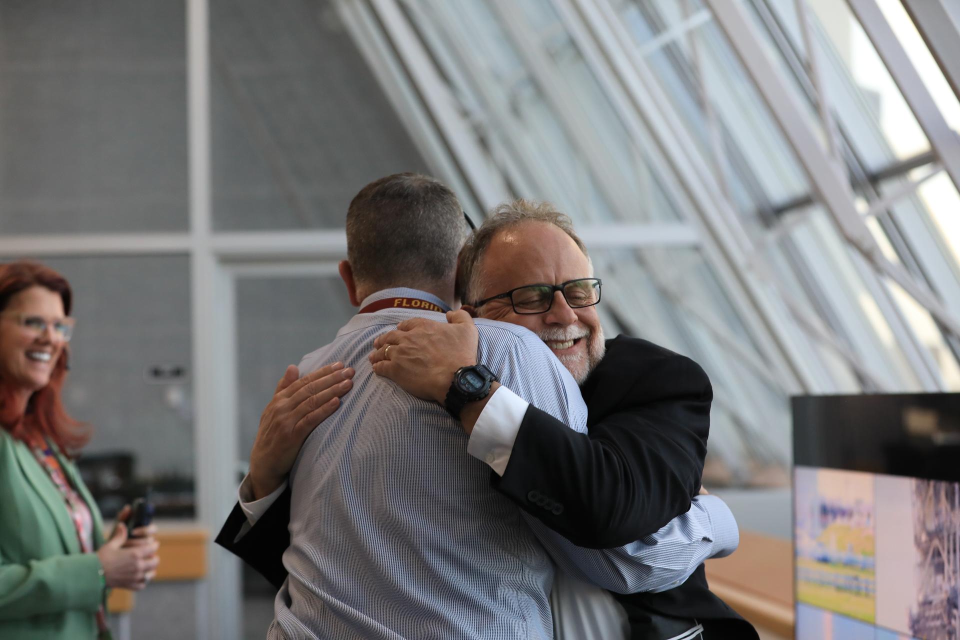 From left, Jeremy Graeber, assistant launch director, and Shawn Quinn, manager, each from NASA’s Exploration Ground Systems Program, smile and hug inside Firing Room 1 of the Rocco A. Petrone Launch Control Center following the launch of the Artemis II test flight on Wednesday, April 1, 2026. The Artemis II mission launched Commander Reid Wiseman, Pilot Victor Glover, and Mission Specialist Christina Koch from NASA, and Mission Specialist Jeremy Hansen from the CSA (Canadian Space Agency), aboard NASA’s SLS (Space Launch System) rocket and Orion spacecraft to journey for 10 days around the Moon and back to Earth.
