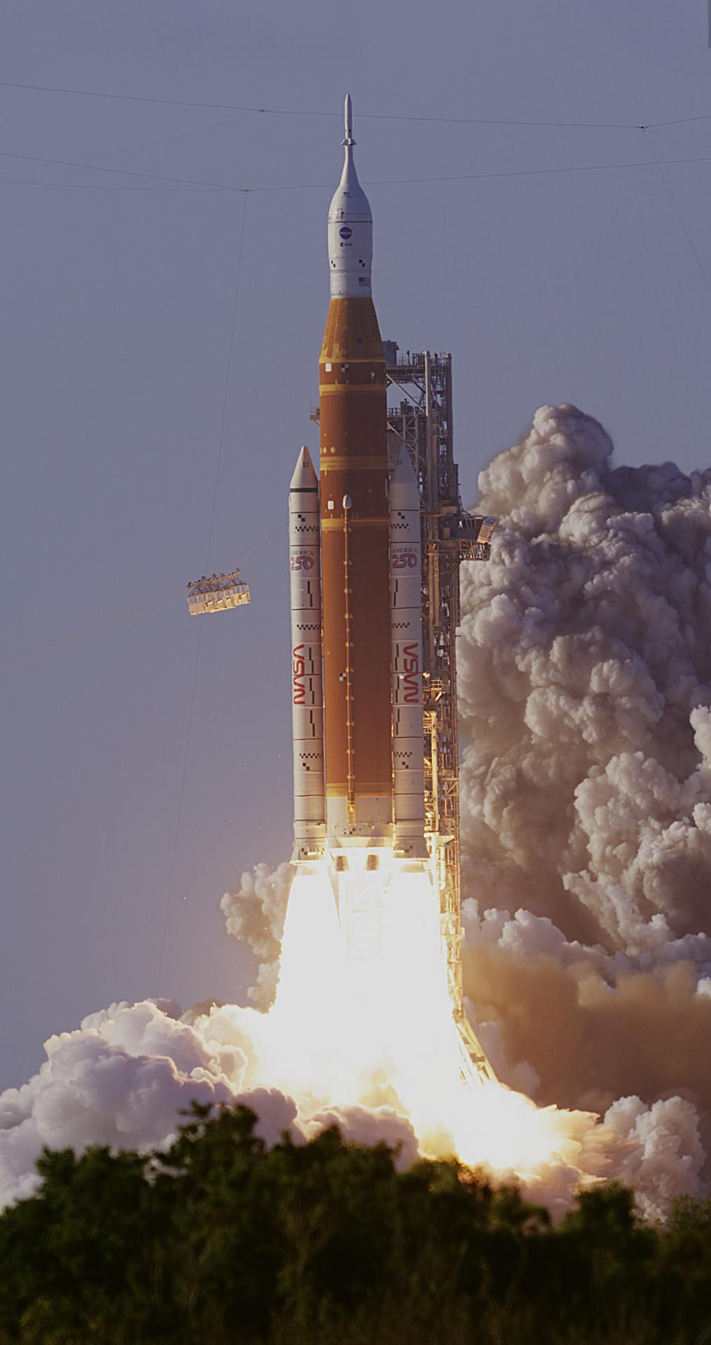 NASA’s SLS (Space Launch System) rocket with the Orion spacecraft carrying Artemis II Commander Reid Wiseman, Pilot Victor Glover, and Mission Specialist Christina Koch from NASA, along with Mission Specialist Jeremy Hansen from the CSA (Canadian Space Agency), lifts off at 6:35 p.m. EDT on Wednesday, April 1, 2026, from Launch Complex 39B at NASA’s Kennedy Space Center in Florida. The Artemis II test flight will take the crew members on a 10-day journey around the Moon and back.