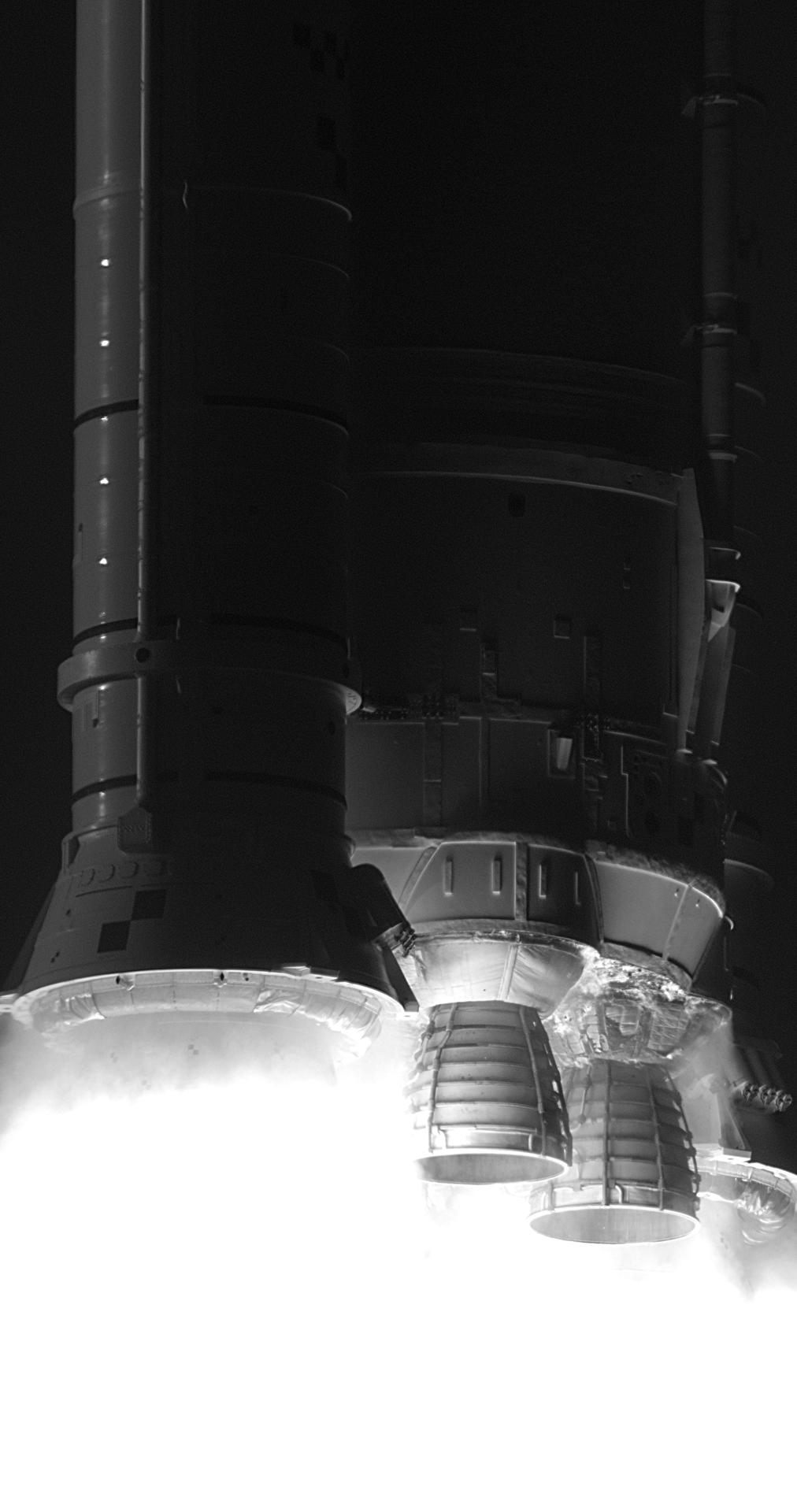 In this black and white infrared image, NASA’s SLS (Space Launch System) rocket with the Orion spacecraft carrying Artemis II Commander Reid Wiseman, Pilot Victor Glover, and Mission Specialist Christina Koch from NASA, along with Mission Specialist Jeremy Hansen from the CSA (Canadian Space Agency), lifts off at 6:35 p.m. EDT on Wednesday, April 1, 2026, from Launch Complex 39B at NASA’s Kennedy Space Center in Florida. The Artemis II test flight will take the crew members on a 10-day journey around the Moon and back.