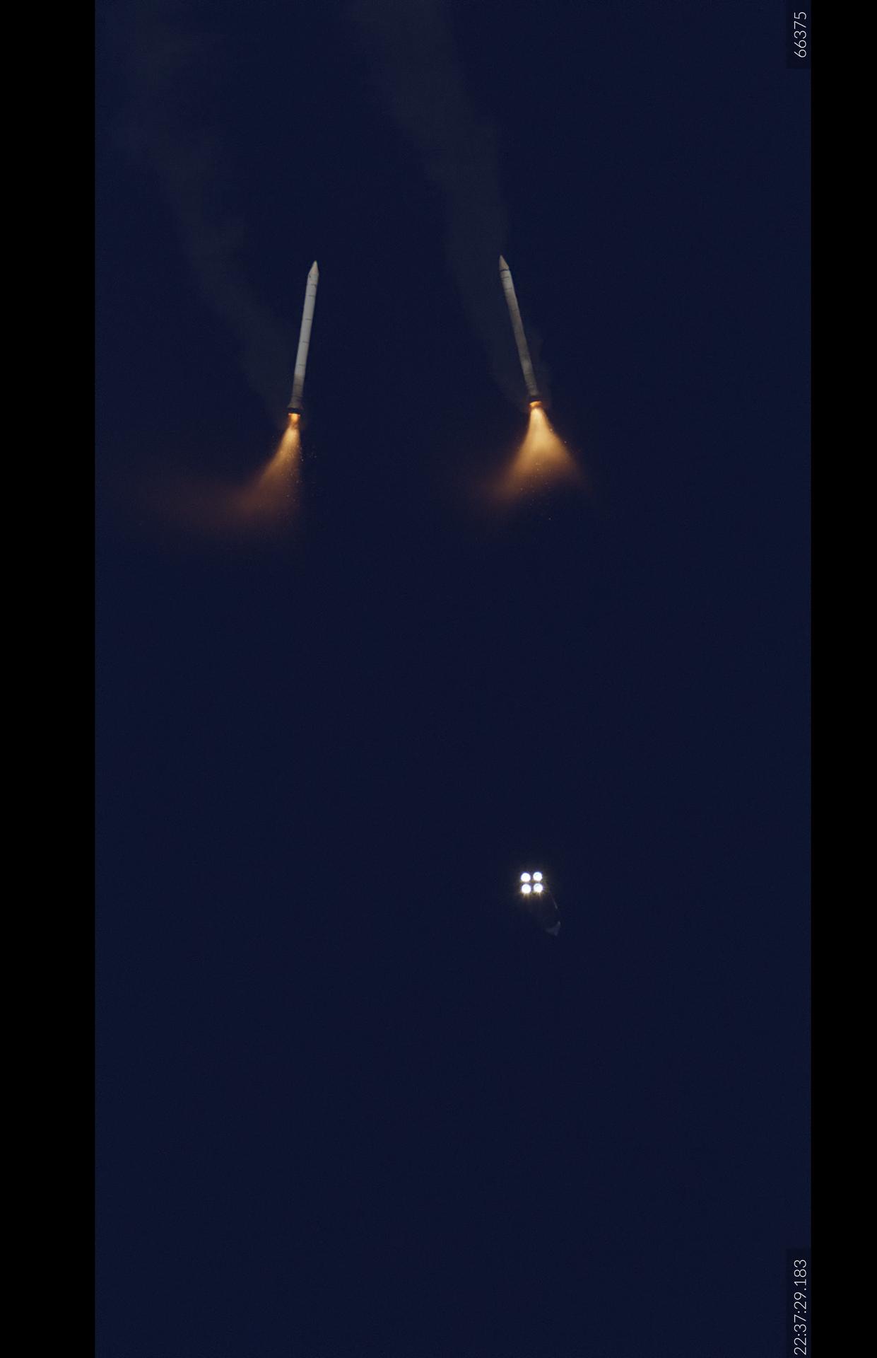 Two solid rocket boosters from NASA’s SLS (Space Launch System) rocket separate from the core stage and Orion spacecraft carrying Artemis II Commander Reid Wiseman, Pilot Victor Glover, and Mission Specialist Christina Koch from NASA, along with Mission Specialist Jeremy Hansen from the CSA (Canadian Space Agency) following liftoff at 6:35 p.m. EDT on Wednesday, April 1, 2026, from Launch Complex 39B at NASA’s Kennedy Space Center in Florida. The Artemis II test flight will take the crew members on a 10-day journey around the Moon and back.