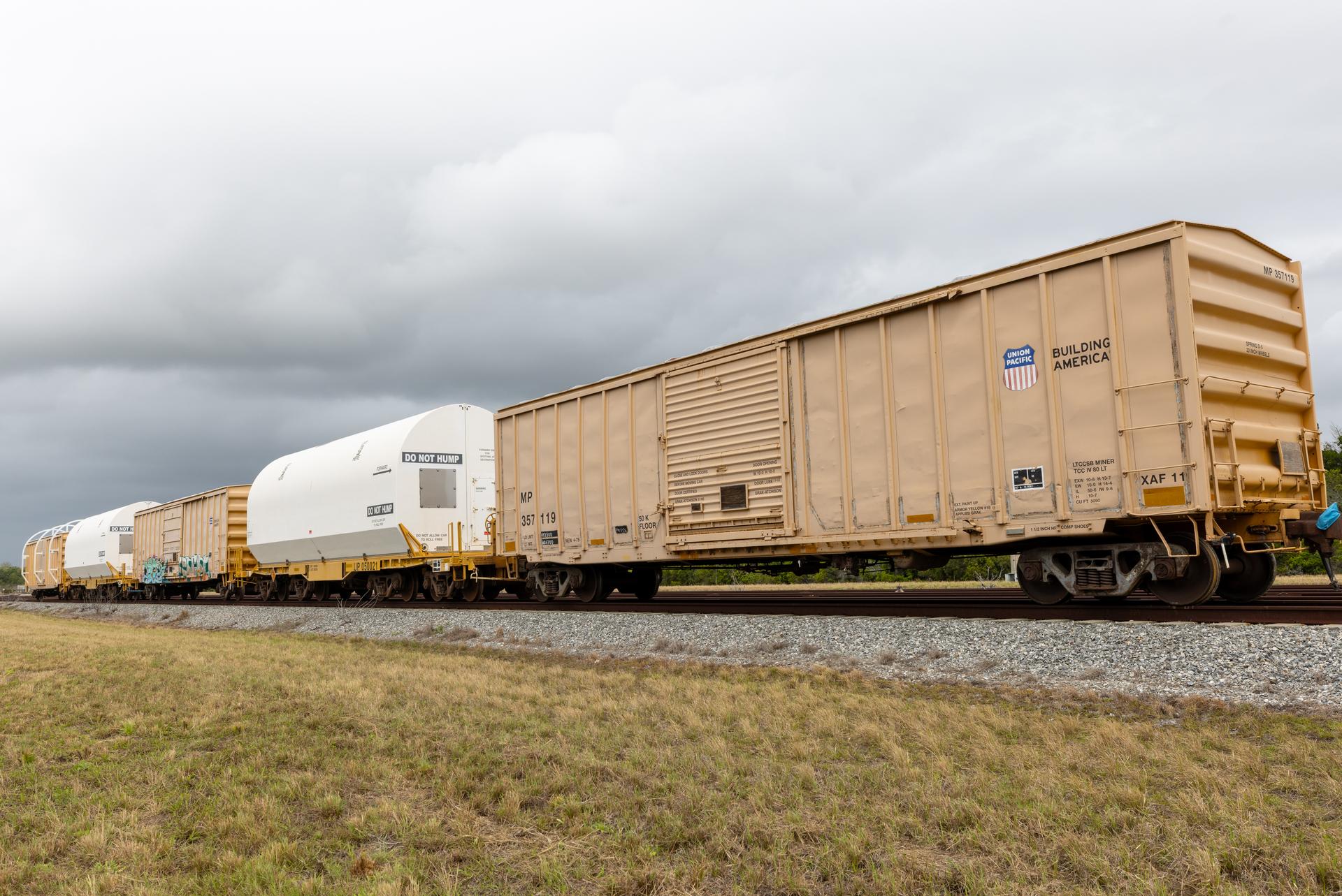 The solid rocket booster aft skirt segments for NASA’s Artemis III SLS (Space Launch System) rocket arrive at a rail yard near the agency’s Kennedy Space Center in Florida on Wednesday, April 8, 2026. Comprising the bottom of the rocket’s twin, five-segment solid rocket boosters, the aft skirt segments traveled by train in specialized transporters to the Florida spaceport and will be transferred from the rail yard to NASA Kennedy’s Rotation, Processing and Surge Facility for processing. The Artemis III mission will launch crew in the Orion spacecraft on top of the SLS rocket to test rendezvous and docking capabilities between Orion and commercial spacecraft needed to land astronauts on the Moon. 