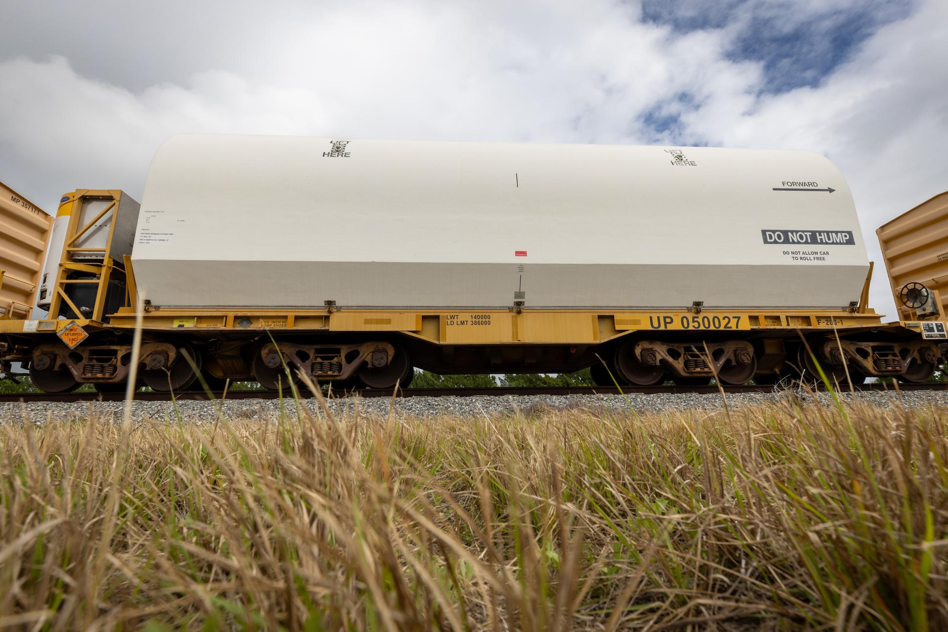 The solid rocket booster aft skirt segments for NASA’s Artemis III SLS (Space Launch System) rocket arrive at a rail yard near the agency’s Kennedy Space Center in Florida on Wednesday, April 8, 2026. Comprising the bottom of the rocket’s twin, five-segment solid rocket boosters, the aft skirt segments traveled by train in specialized transporters to the Florida spaceport and will be transferred from the rail yard to NASA Kennedy’s Rotation, Processing and Surge Facility for processing. The Artemis III mission will launch crew in the Orion spacecraft on top of the SLS rocket to test rendezvous and docking capabilities between Orion and commercial spacecraft needed to land astronauts on the Moon. 