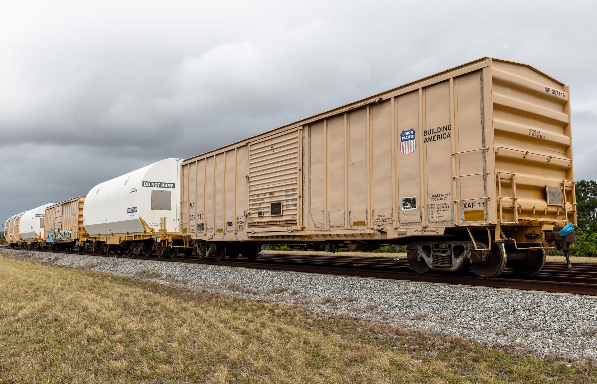 The solid rocket booster aft skirt segments for NASA’s Artemis III SLS (Space Launch System) rocket arrive at a rail yard near the agency’s Kennedy Space Center in Florida on Wednesday, April 8, 2026. Comprising the bottom of the rocket’s twin, five-segment solid rocket boosters, the aft skirt segments traveled by train in specialized transporters to the Florida spaceport and will be transferred from the rail yard to NASA Kennedy’s Rotation, Processing and Surge Facility for processing. The Artemis III mission will launch crew in the Orion spacecraft on top of the SLS rocket to test rendezvous and docking capabilities between Orion and commercial spacecraft needed to land astronauts on the Moon. 