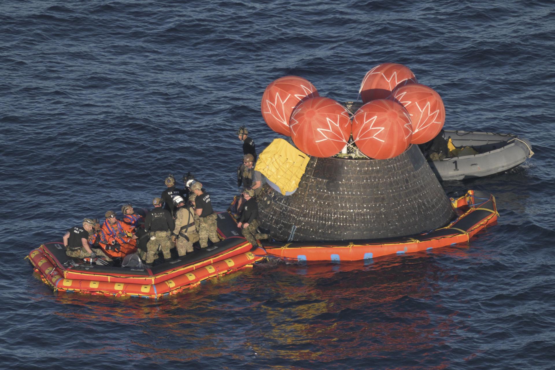 From left to right, Artemis II Mission Specialist Christina Koch and Pilot Victor Glover from NASA, Mission Specialist Jeremy Hansen from the CSA (Canadian Space Agency), and Commander Reid Wiseman from NASA, are extracted from NASA’s Orion spacecraft and loaded onto an inflatable raft, called the front porch, following splashdown in the Pacific Ocean near San Diego, California, at 5:07 p.m. PDT, (8:07 p.m. EDT) on Friday, April 10, 2026. The Artemis II crew will be taken to USS John P. Murtha to be routinely examined while NASA’s Landing and Recovery team and the U.S. Navy recover Orion and secure it in the well deck of USS John P. Murtha. The Artemis II test flight launched on Wednesday, April 1, from NASA’s Kennedy Space Center in Florida to begin its 10- day journey around the Moon for scientific discovery, economic benefits, and to build on our foundation for the first crewed missions to Mars.