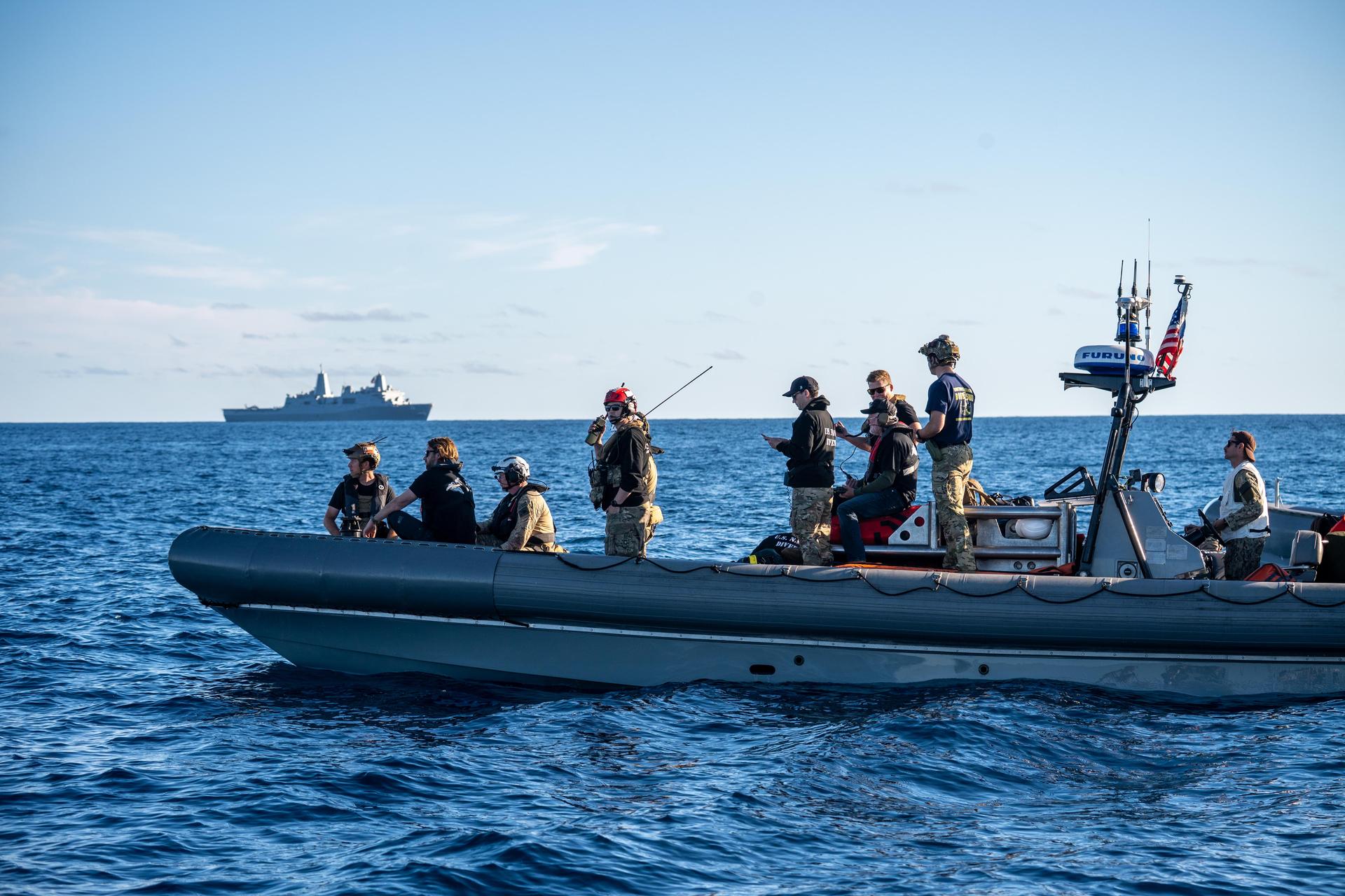 U.S. Navy personnel aboard an inflatable raft help recover NASA's Orion spacecraft following its splashdown in the Pacific Ocean near San Diego, California, at 5:07 p.m. PDT, (8:07 p.m. EDT) on Friday, April 10, 2026, after the Artemis II test flight. The Artemis II mission carrying Artemis II Commander Reid Wiseman, Pilot Victor Glover, and Mission Specialist Christina Koch from NASA, along with Mission Specialist Jeremy Hansen from the CSA (Canadian Space Agency), launched on Wednesday, April 1, from NASA’s Kennedy Space Center in Florida to begin its 10-day journey around the Moon for scientific discovery, economic benefits, and to build on our foundation for the first crewed missions to Mars. NASA’s Landing and Recovery team and the U.S. Navy are coordinating efforts to secure Orion in the well deck of USS John P. Murtha. 