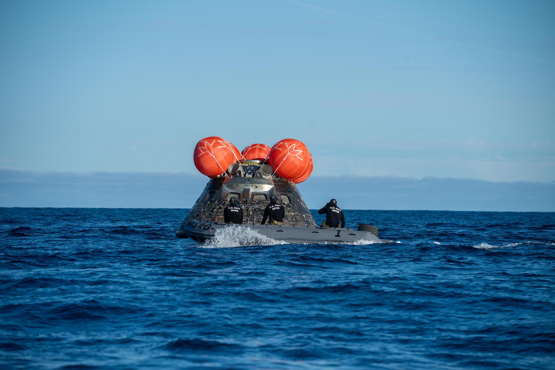 NASA’s Landing and Recovery team, along with U.S. Navy personnel aboard an inflatable raft approach NASA’s Orion spacecraft carrying Artemis II Commander Reid Wiseman, Pilot Victor Glover, and Mission Specialist Christina Koch from NASA, along with Mission Specialist Jeremy Hansen from the CSA (Canadian Space Agency), following splashdown in the Pacific Ocean near San Diego, California, at 5:07 p.m. PDT, (8:07 p.m. EDT) on Friday, April 10, 2026. The Artemis II test flight launched on Wednesday, April 1, from NASA’s Kennedy Space Center in Florida to begin its 10-day journey around the Moon for scientific discovery, economic benefits, and to build on our foundation for the first crewed missions to Mars. NASA’s Landing and Recovery team and the U.S. military are helping the Artemis II crew out of their Orion spacecraft. 
