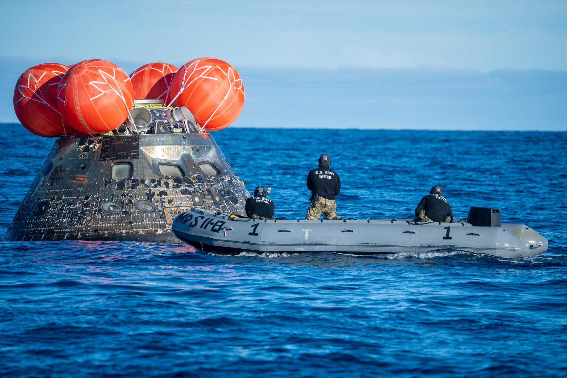 NASA’s Landing and Recovery team, along with U.S. Navy personnel aboard an inflatable raft approach NASA’s Orion spacecraft carrying Artemis II Commander Reid Wiseman, Pilot Victor Glover, and Mission Specialist Christina Koch from NASA, along with Mission Specialist Jeremy Hansen from the CSA (Canadian Space Agency), following splashdown in the Pacific Ocean near San Diego, California, at 5:07 p.m. PDT, (8:07 p.m. EDT) on Friday, April 10, 2026. The Artemis II test flight launched on Wednesday, April 1, from NASA’s Kennedy Space Center in Florida to begin its 10-day journey around the Moon for scientific discovery, economic benefits, and to build on our foundation for the first crewed missions to Mars. NASA’s Landing and Recovery team and the U.S. military are helping the Artemis II crew out of their Orion spacecraft. 