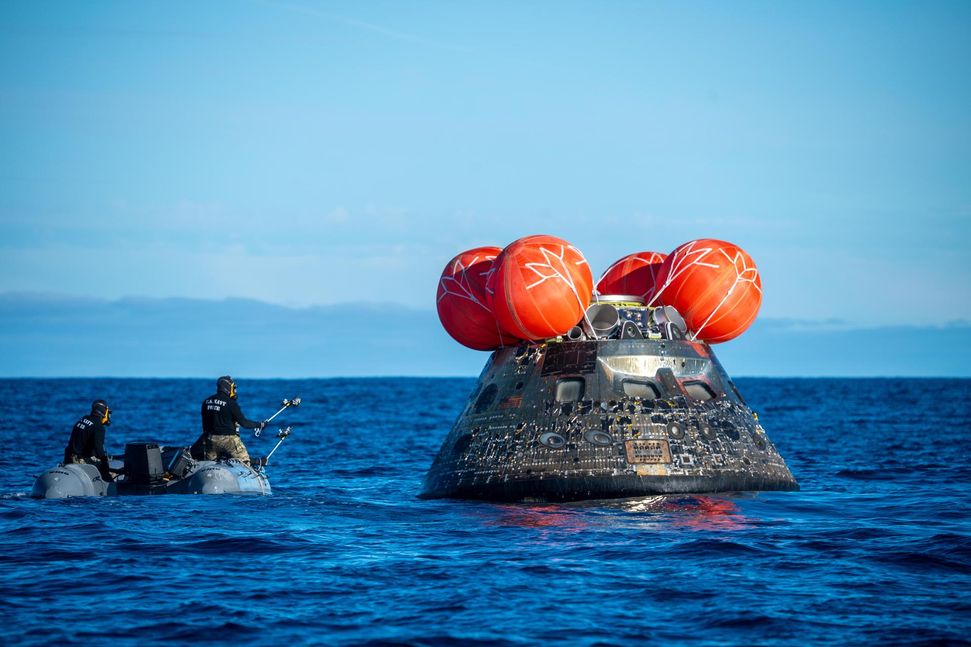 NASA’s Landing and Recovery team, along with U.S. Navy personnel aboard an inflatable raft approach NASA’s Orion spacecraft carrying Artemis II Commander Reid Wiseman, Pilot Victor Glover, and Mission Specialist Christina Koch from NASA, along with Mission Specialist Jeremy Hansen from the CSA (Canadian Space Agency), following splashdown in the Pacific Ocean near San Diego, California, at 5:07 p.m. PDT, (8:07 p.m. EDT) on Friday, April 10, 2026. The Artemis II test flight launched on Wednesday, April 1, from NASA’s Kennedy Space Center in Florida to begin its 10-day journey around the Moon for scientific discovery, economic benefits, and to build on our foundation for the first crewed missions to Mars. NASA’s Landing and Recovery team and the U.S. military are helping the Artemis II crew out of their Orion spacecraft. 
